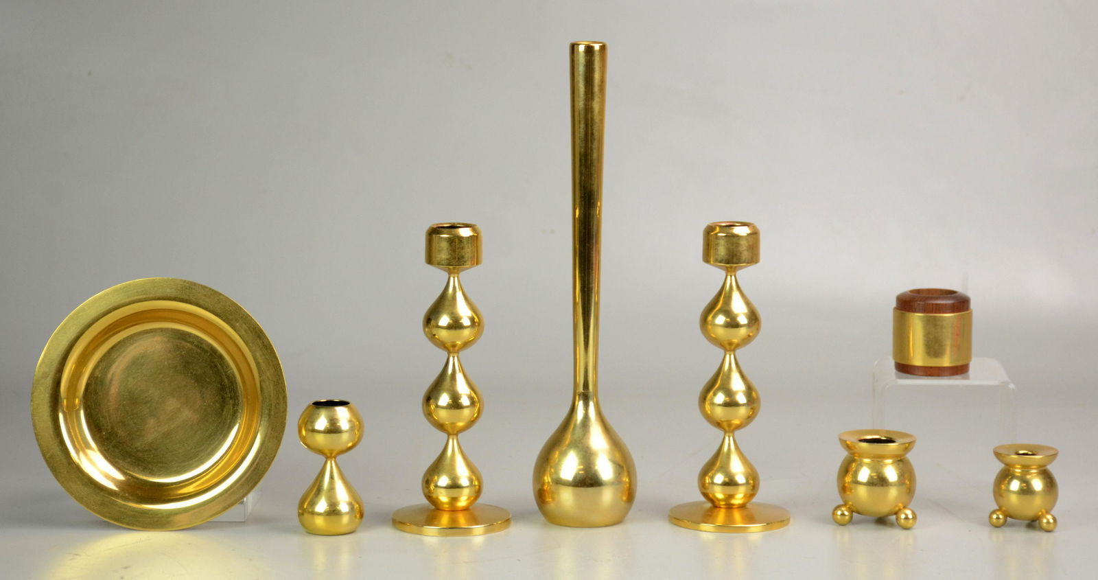 (8) Pcs. Asmussen Danish Modern 24K Plated: (8) Pcs. Hugo Asmussen Danish modern 24K plated pieces, c. 1960, c/o pr. tall candleholders, small candleholders, small tray, toothpick holders, fully stamped to base