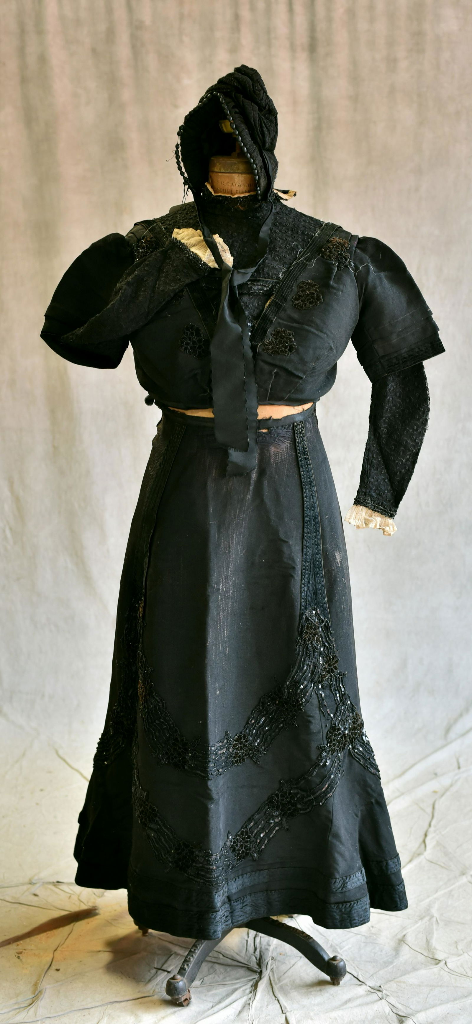 Full Victorian Walking Outfit: Full Victorian walking outfit to include (1) early ruched silk bonnet with bead trim, collapsible silk parasol, kidskin boots with glass buttons, lace and cotton bodice with net lace cuffs, silk and j