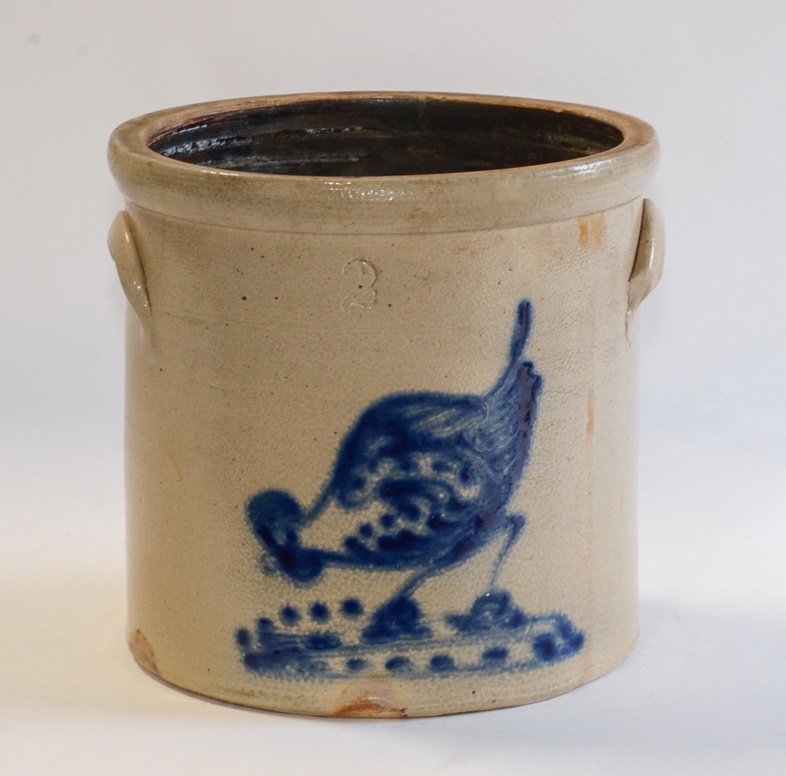 2 gallon blue chicken pecking corn decorated jug: 2 gallon blue chicken pecking corn decorated stoneware jug, unsigned , 9 1/4" high, 9 3/4" d, crack repaired at back
