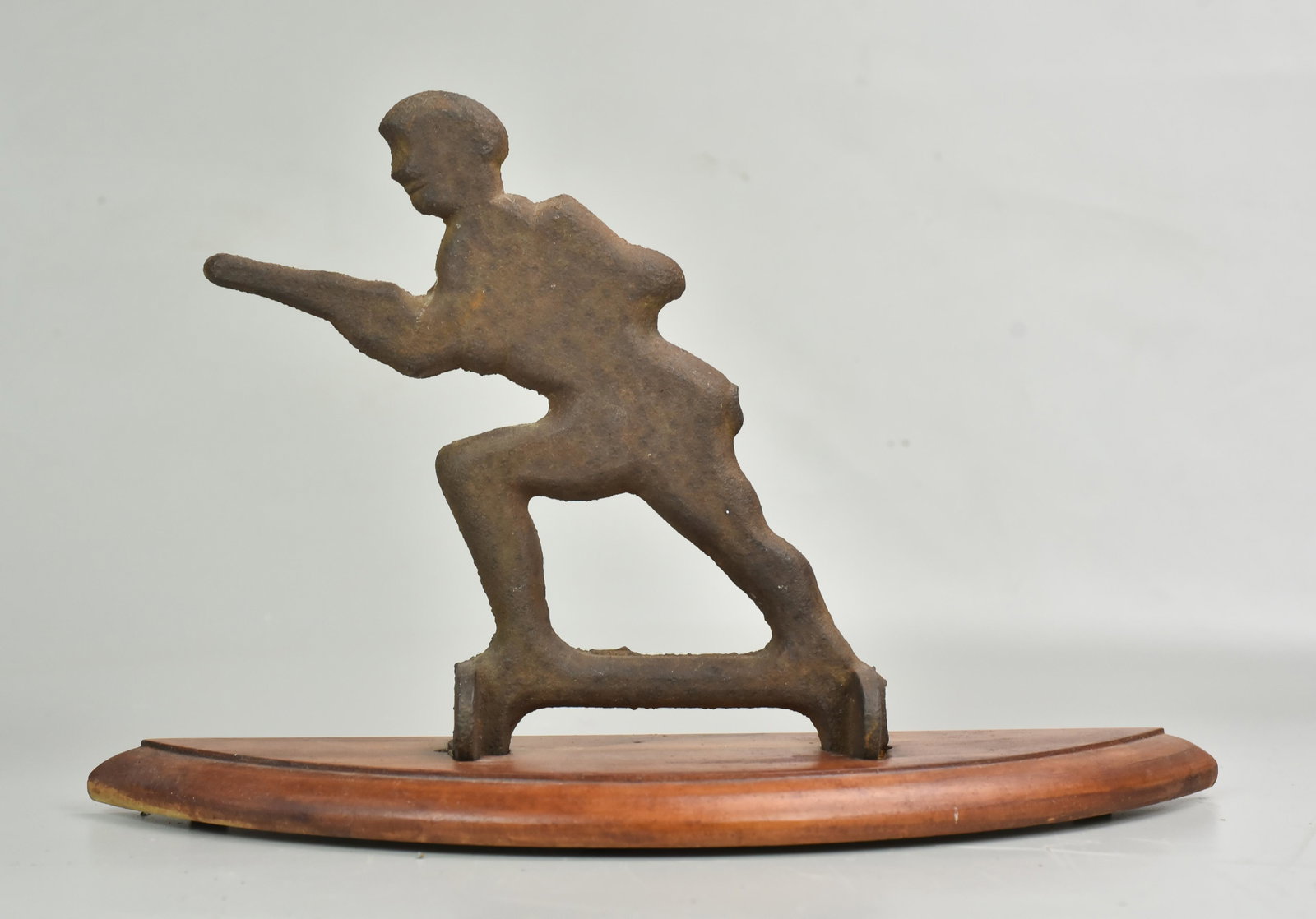 Cast iron arcade shooting gallery target, Man with: Cast iron arcade shooting gallery target, Man with Rifle, on wood base, 8" h, 13" l