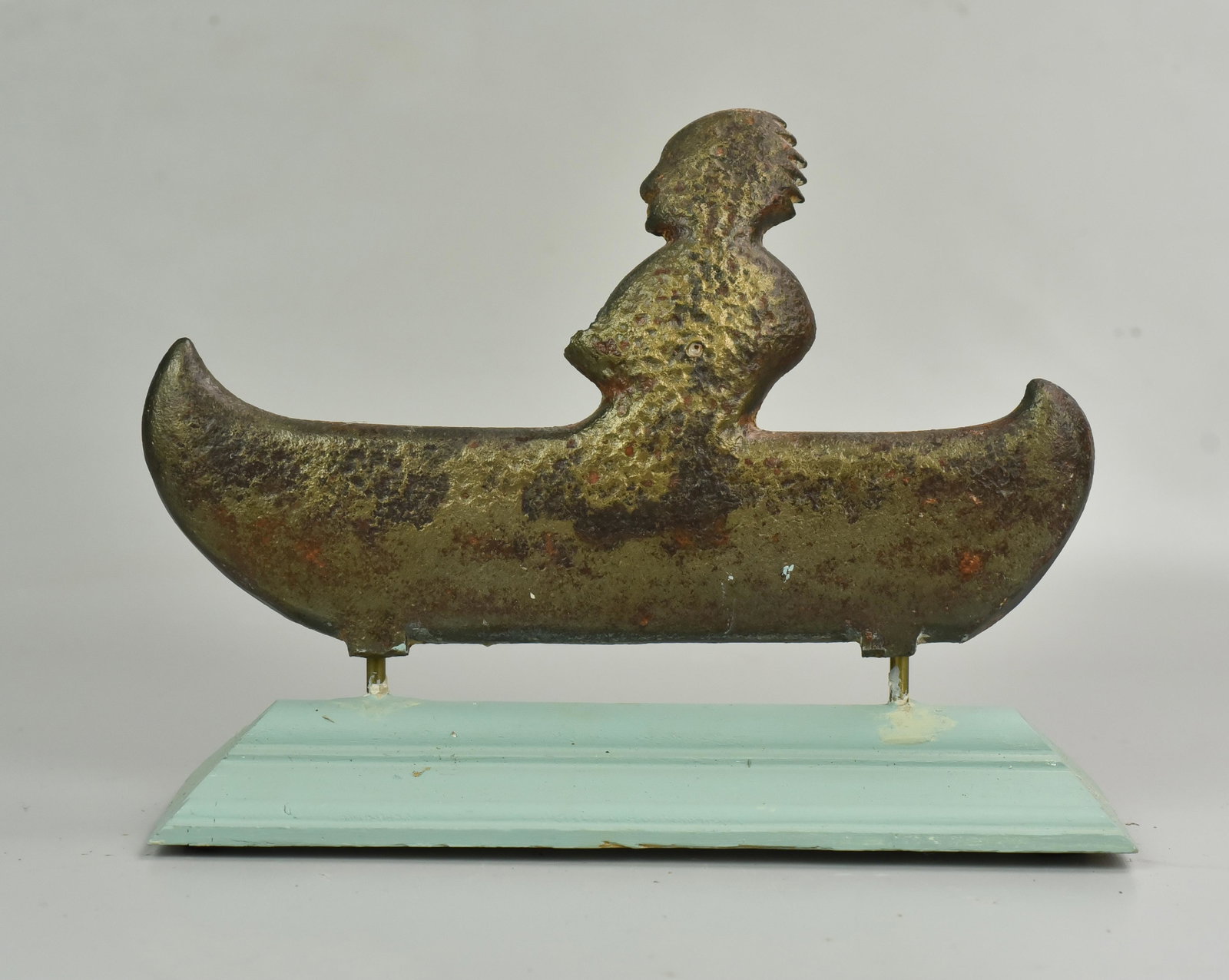 Cast iron arcade shooting gallery target, Figure in: Cast iron arcade shooting gallery target, Figure in Canoe, on wood base, 9 1/4" l, 7" h
