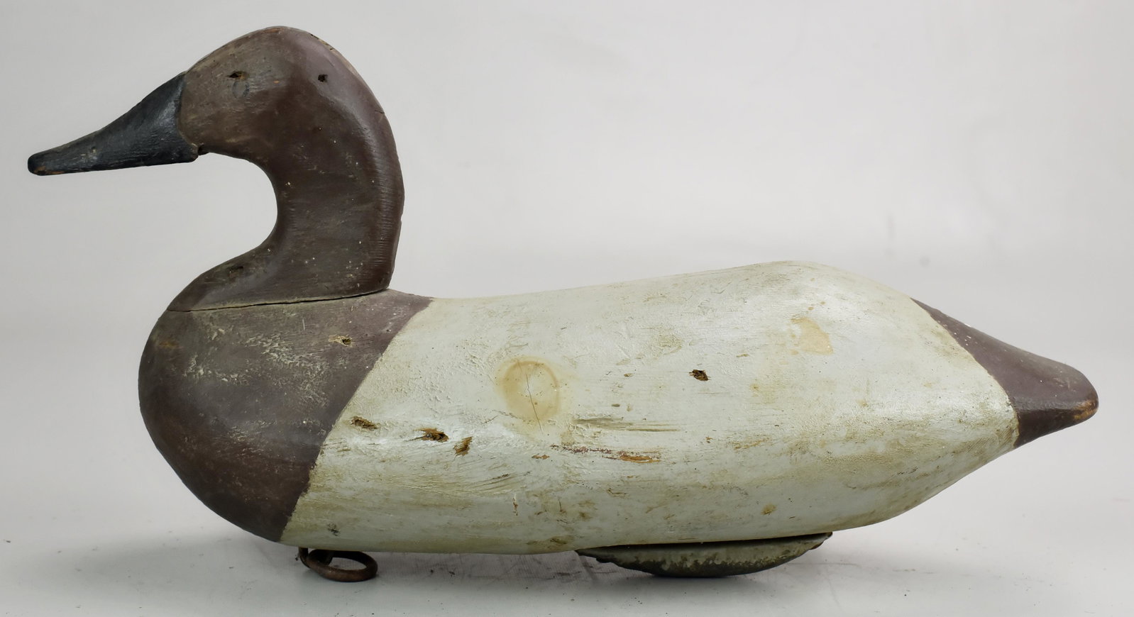 Wally Algard, Charlestown, MD, canvasback duck decoy: Wally Algard, Charlestown, MD, carved and painted canvasback duck decoy, repaired at head and neck, some repaint on body, 16" long. Collection of Richard Matlat, the carver attributions are based on n