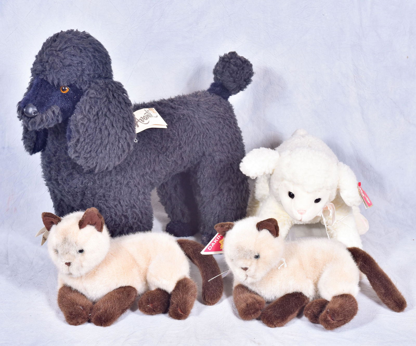 Avanti handmade plush standard black poodle: Avanti handmade plush standard black poodle, copyright 1986 by Applause & Jockline, Designed by Jockline of Italy, 22"l x 19-1/2"h, along with (2) Dakin plush cats, 14"l and a TY "lovie lamb" 16"l