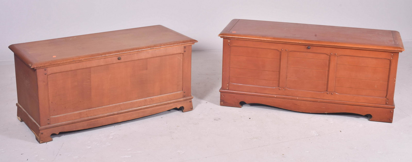 (2) Lane paneled cedar chests: (2) Lane paneled cedar chests, first interior with divided shelf on lid, second with shelf removed, largest 21" h x 41" w x 19-1/4" d