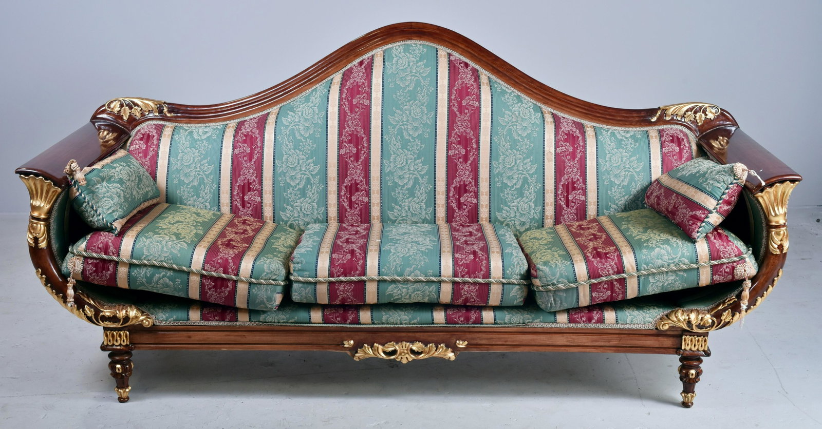 Carved & gilt French style sofa: Carved & gilt French style sofa, gilt highlights, striped upholstery with floral and swag decoration, 41" h x 88" w x 32" d