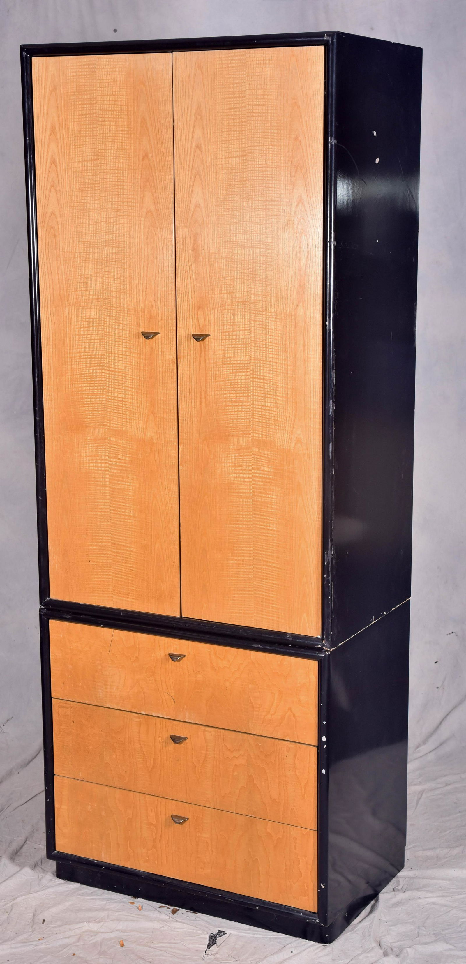 John Stuart ebonized and walnut 2-pc wardrobe: John Stuart ebonized and walnut 2-pc wardrobe, top interior with mirror on doors fitted interior with drawers and shelves with dividers, base with three drawers, 80" h x 31" w x 20" d, loss of paint,