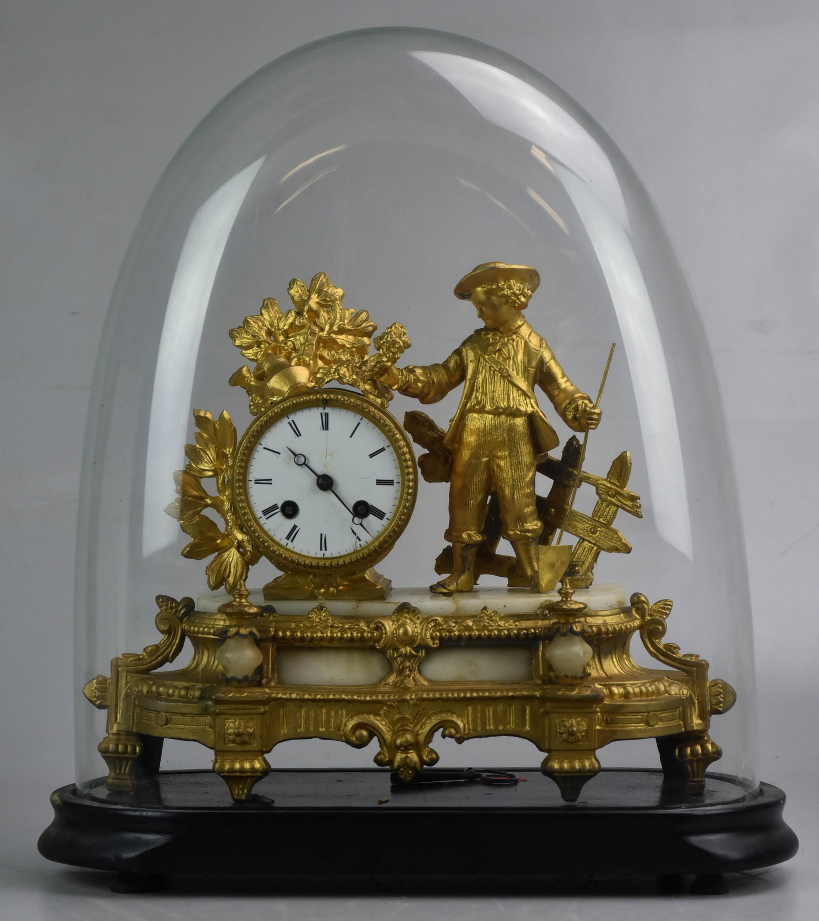 French white metal figural mantle clock under a glass: French white metal figural mantle clock under a glass dome, alabaster base with crack, neck repaired on figure, Japy Freres movement, clock 11" h. dome 18" high