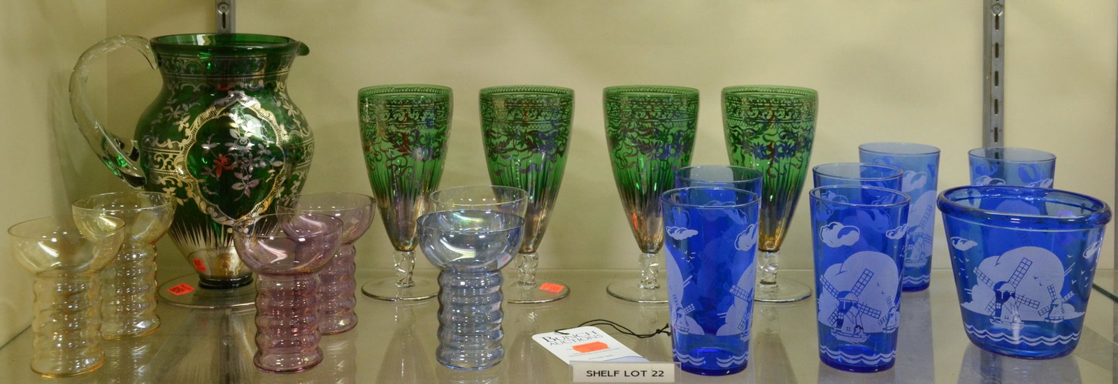 Shelf #22 - Glass Drink Sets: Shelf #22 - Green Drink Set with Silver Overlay Including: Pitcher and (4) Cups, Hazel Atlas Ice Bucket and (6) Glasses, (6) Ribbed Glasses in Multiple Colors
