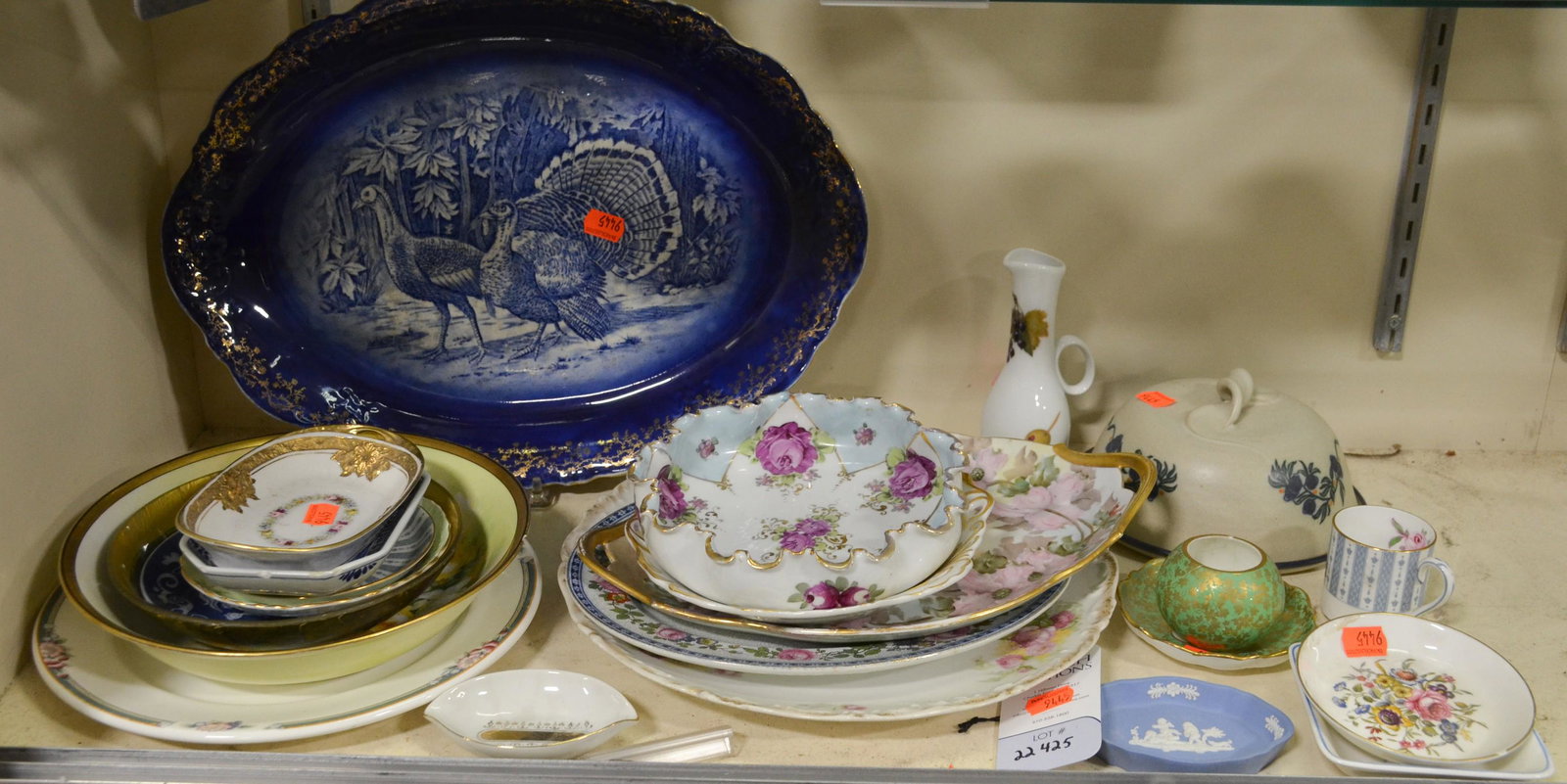 Shelf #25 - Porcelain Lot: Shelf #25 - Porcelain Including: Delft Dish, Staffordshire Cup, Royal Copenhagen Dish, Nippon Dish, French Turkey Platter, Limoges Plates