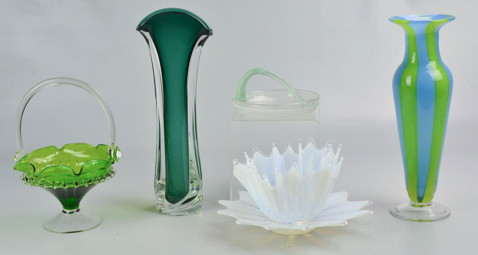 Art Glass Grouping: Art glass grouping c/o opaline bowl and underplate, applied riggory green glass basket, handled dish and (2) signed art glass vases, tallest 14" , one with imperfection at lip