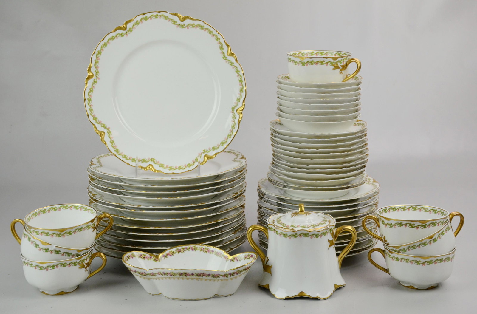 (54) Piece Haviland Limoges Clover Leaf Pattern: (54) Piece Haviland Limoges Clover Leaf Pattern Dinnerware Including: (14) Dinner Plates, (11) Salad Plates, (8) Fruit Bowls, (7) Teacups, (12) saucers, (1) Sugar, (1) Nut Dish