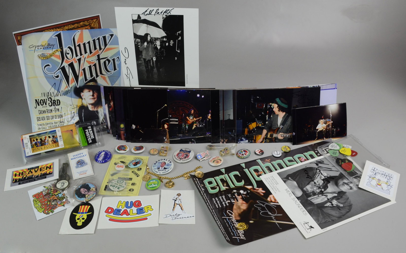 Lot of Grateful Dead/Jerry Garcia Memorabilia: Lot of various Grateful Dead/Jerry Garcia oriented memorabilia to include calendars, stickers, photos, buttons, pins, stamps, newspaper and magazine articles, postcards, concert poster, 1986 replica f