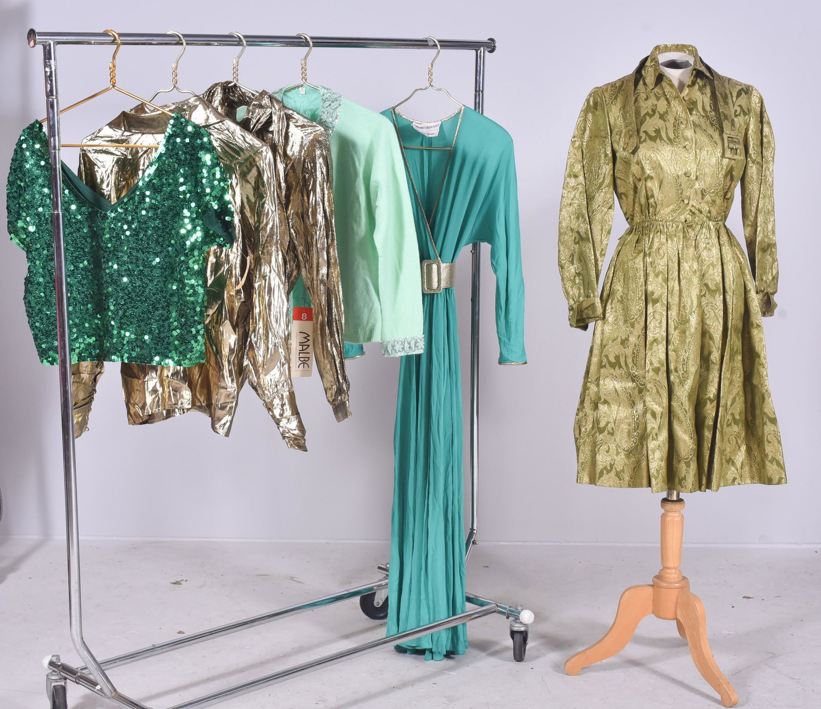 (6) Piece Vintage Grouping: (6) Piece vintage grouping to include (1) Tom and Linda Platt for Saks Fifth Avenue rayon maxi dress in emerald green with gold lame trim and belt, 34" bust 26" waist with stretch and free hips, (2) g
