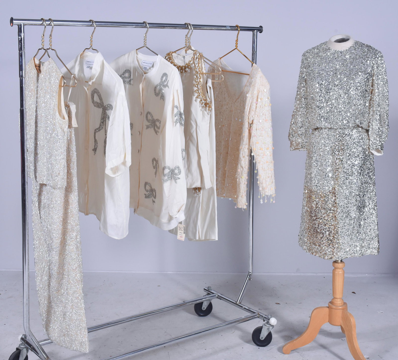 Vintage White Sequin Grouping: Vintage white sequin grouping to include 1960's Bruce Arnold silk two piece full length skirt and sleeveless blouse fully adorned with star pattern sequins and glass beadwork, metal zip at back, 25" w