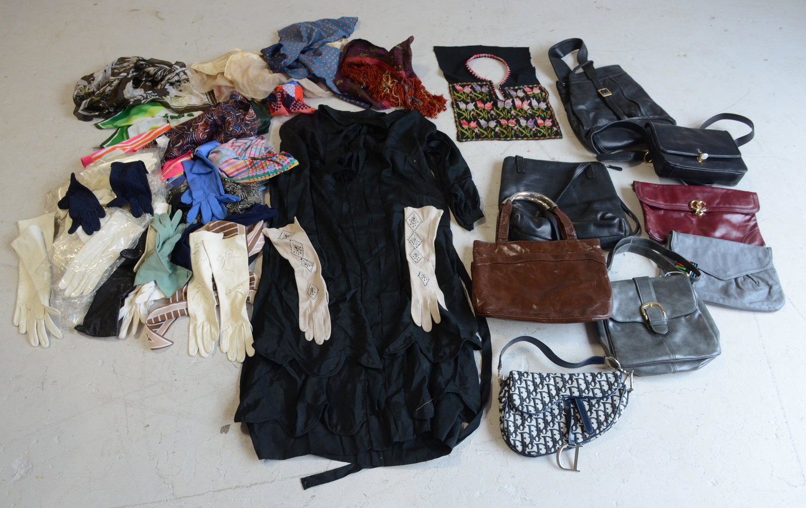 Vintage Purse, Scarf and Glove Grouping: Vintage grouping to include (8) purses in leather, vinyl and patent, 20+ glove pairs in cotton knit, gabardine and more, 10+ scarves and (1) silk victorian openwork dress in poor condition.