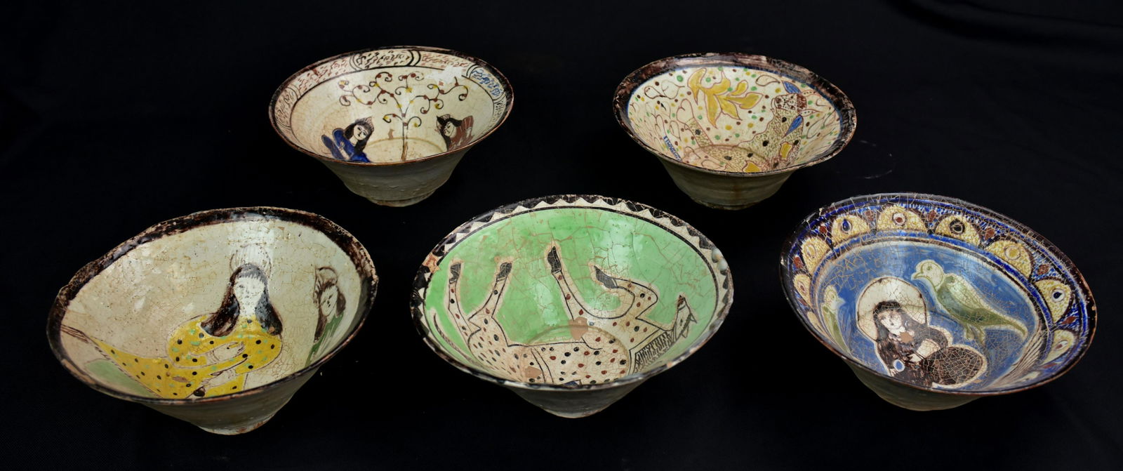 5 Multicolored Stoneware Afghan Serving Bowls: 5 Multicolored Stoneware Afghan Serving Bowls: (A) Yellow, burgundy, black, green and white under-glazed stoneware serving bowl, decorated with a two ladies within a white ground, followed by a black