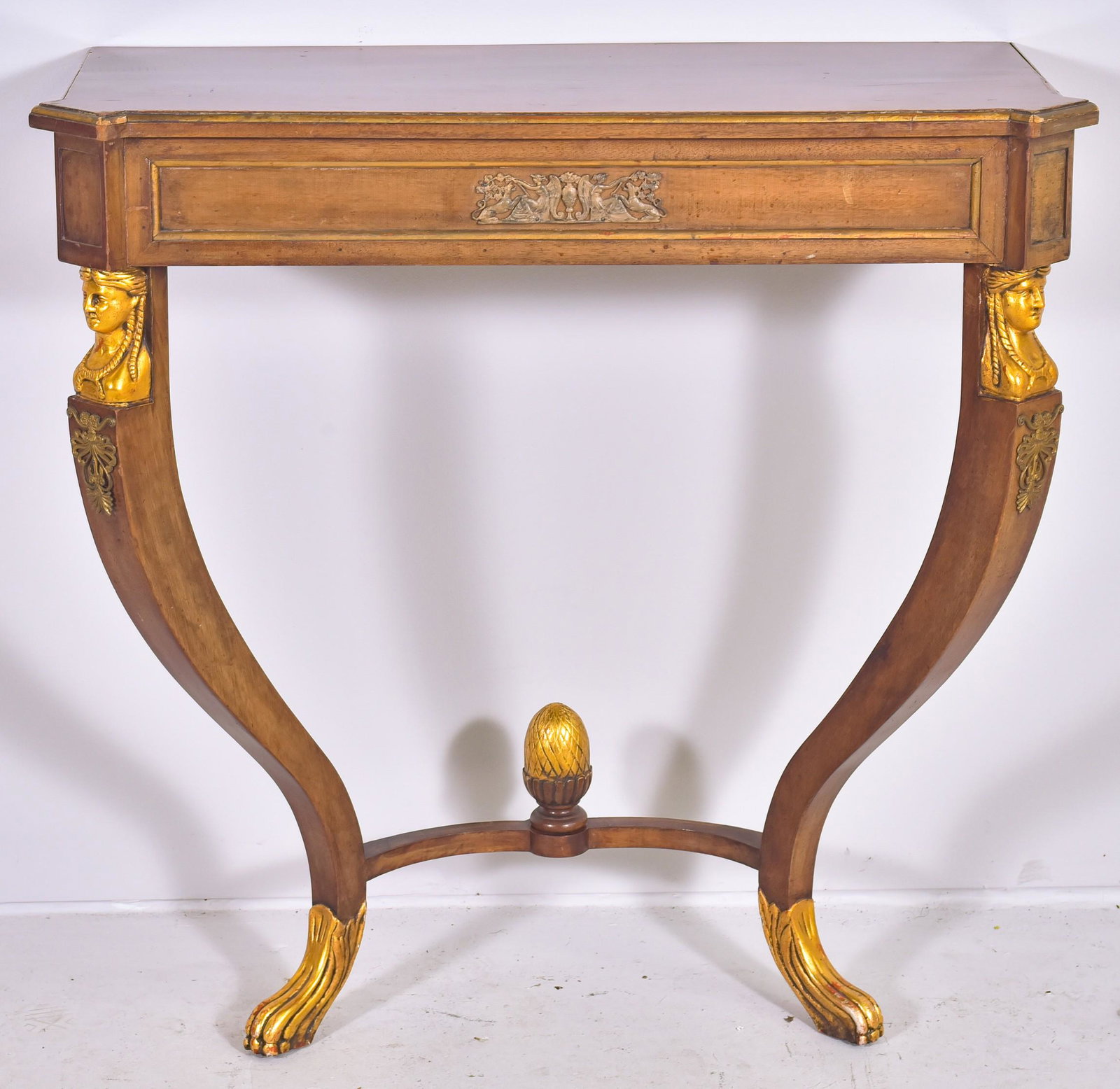 Empire style walnut finished and gilt console table: Empire style walnut finished and gilt console table, gilt ladies faces and paw feet, metal mounts, 33" h x 34" w x 14" d