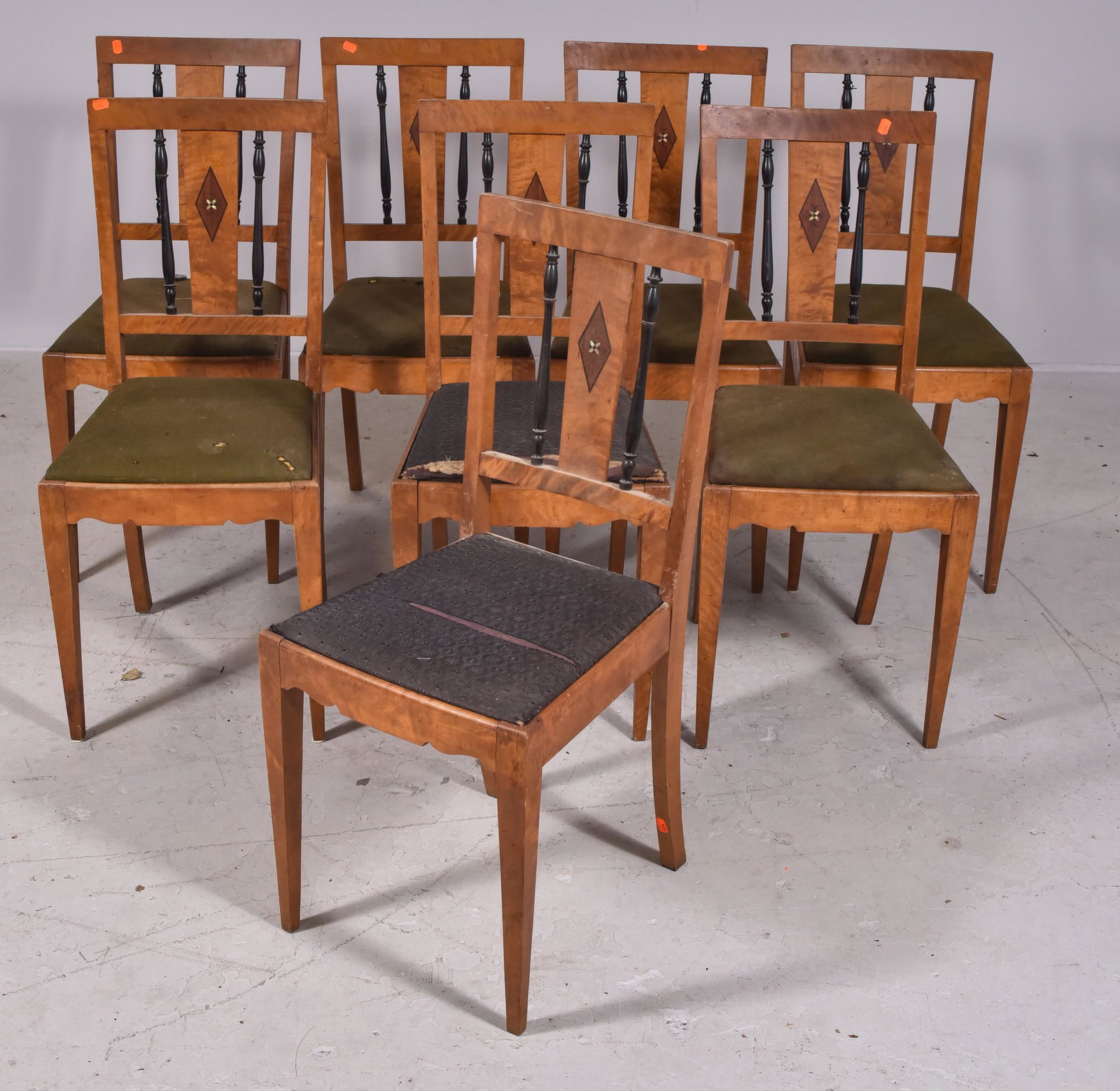 (8) Biedermeier style inlaid side chairs: (8) Biedermeier style inlaid side chairs, ebonized spindles on back, MOP floral decoration, green upholstered seat, 38" h, seat height 18-1/2" h, wear and damage to upholstery