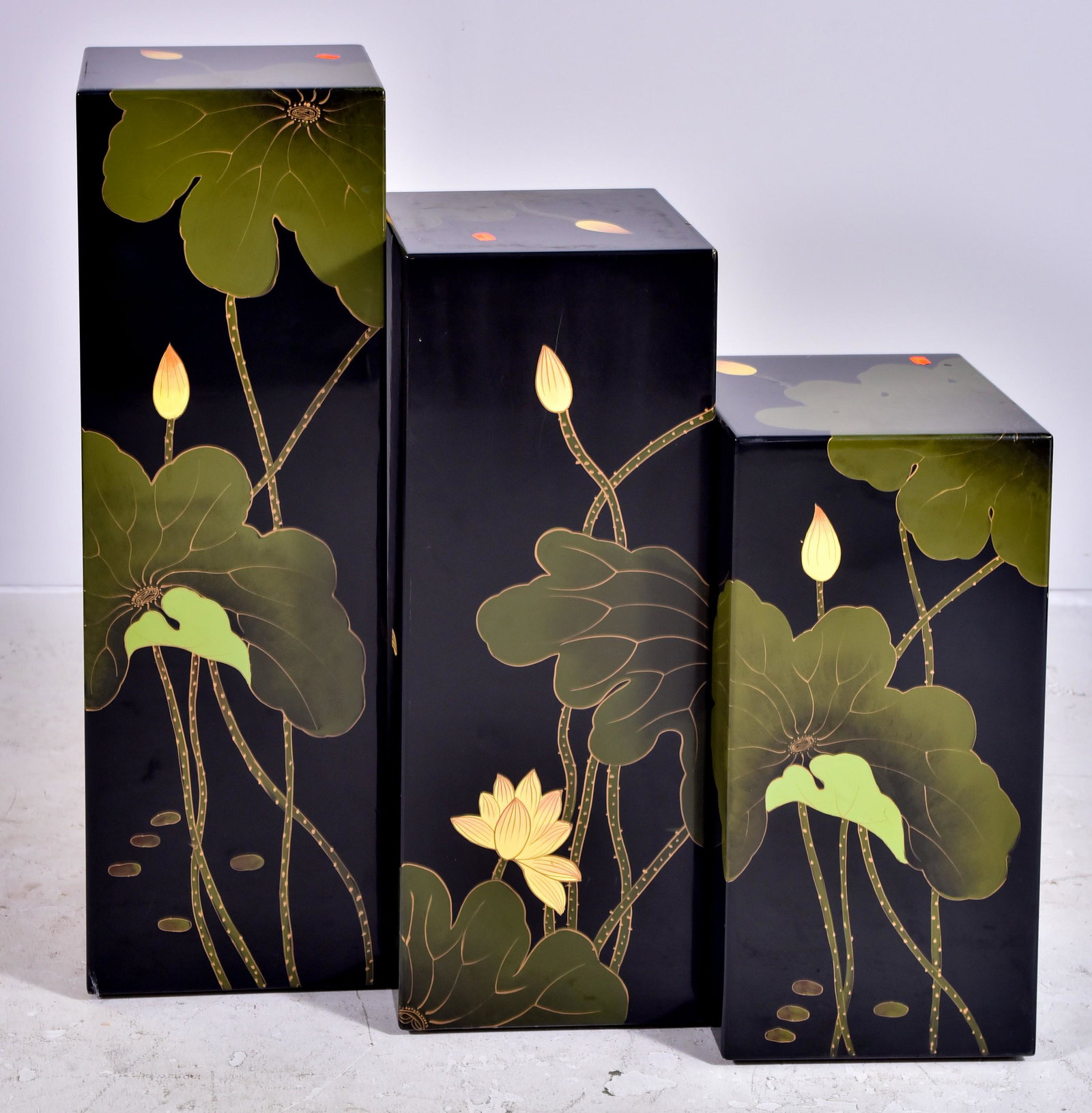 (3) Kel Wee ebonized & painted pedestals: (3) Kel Wee ebonized & painted pedestals, lilly pads and flower decoration, 36" h x 12"sq largest