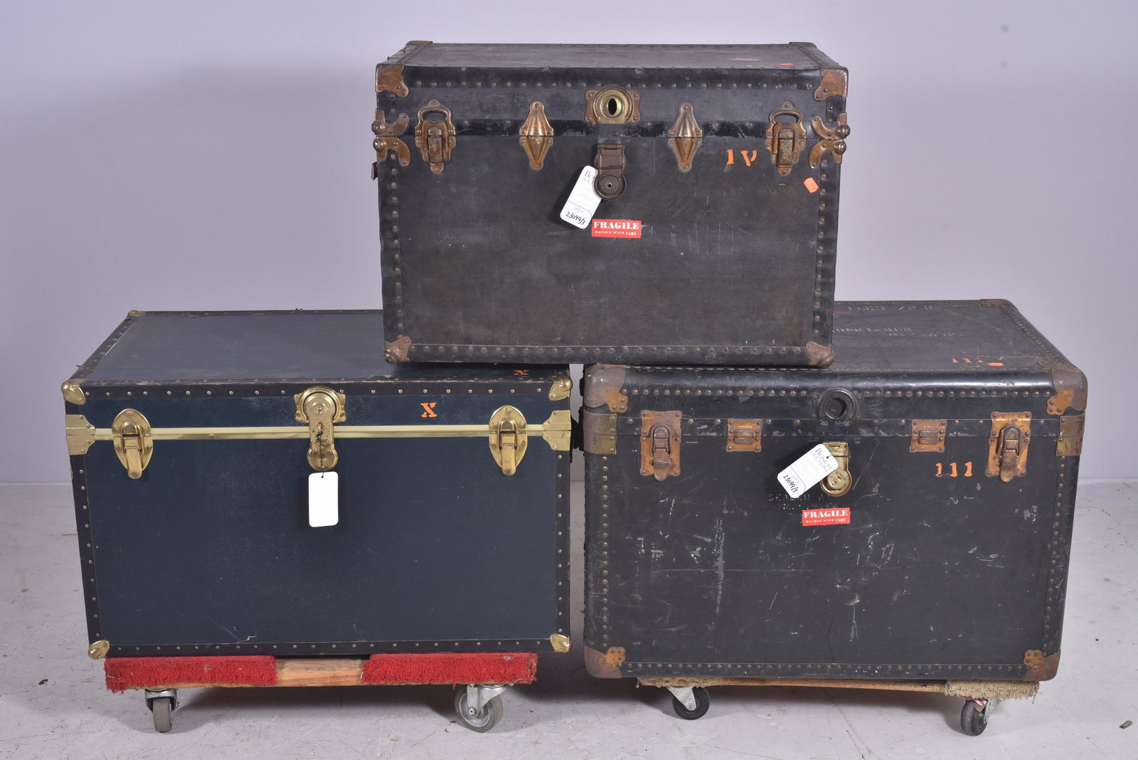 (3) Storage trunks: (3) Storage trunks, metal strapping, 30" w x 15-1/2" d, some with damaged locks