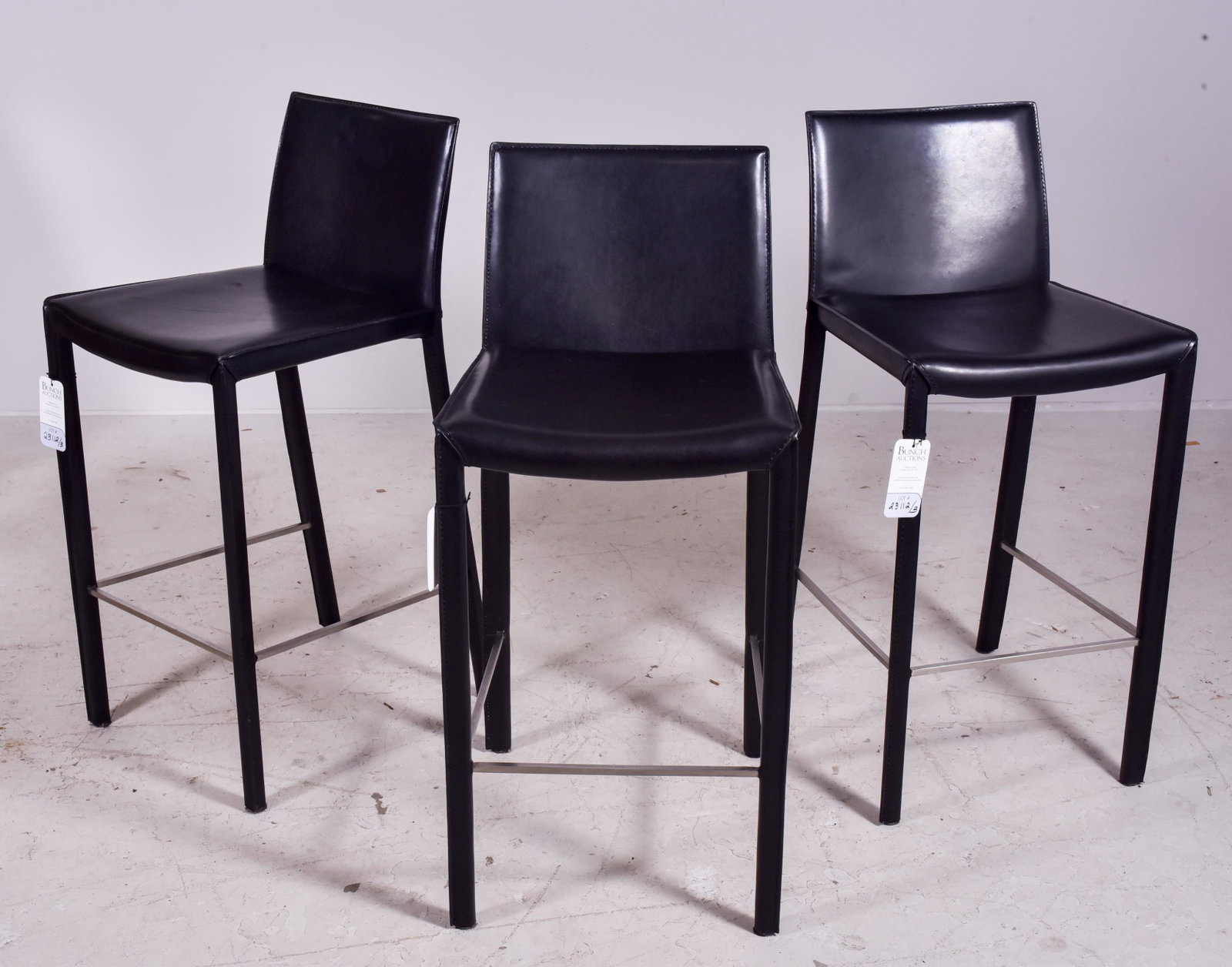 (3) Black leather barstools: (3) Black leather barstools, chrome footrests, 36" h, seat height 27" h