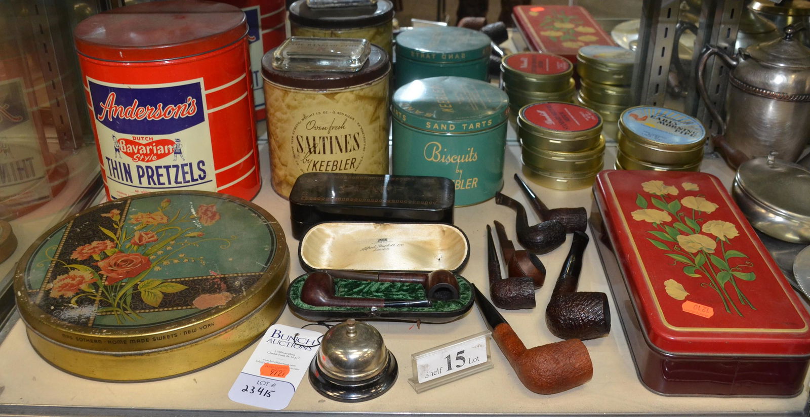 Shelf #15 - Smoking Pipes and Advertising Tins: Shelf #15 - Advertising Tins Including: Mrs. Southern - Homemade Sweets - New York, Anderson's Bavarian Thin Pretzels,Keebler Saltines, Keebler Sand Tarts, Pfaff Box, University of Pennsylvania Paperw