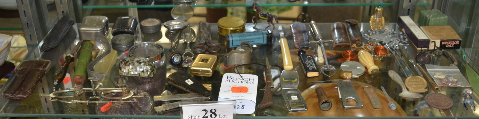 Shelf #28 - Bloodletting Tool, Optometrist Glasses: Shelf #28 - Misc Items Including: Borwich Bloodletting Tool, Scissors, Knives, Optometrist Glasses For Measuring Eyes, Compass, Wrico Lettering Pen, Zenith Hearing Aid