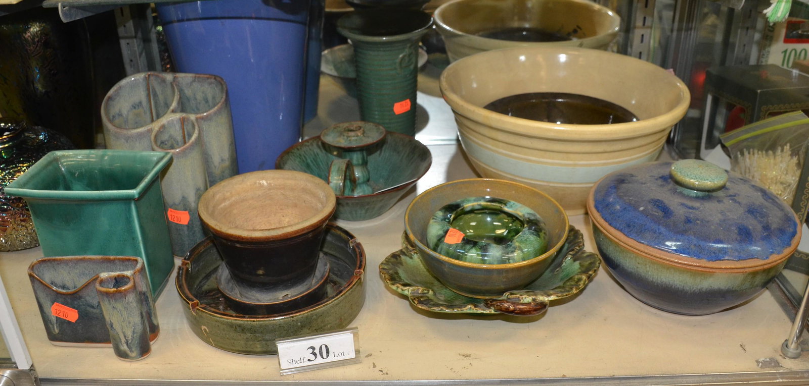 Shelf #30 - Art Pottery and Yellow Ware Bowl: Shelf #30 - Large Yellow Ware Bowl (12" dia), Green Ribbed Vase Signed Elm, Covered Bowl Signed Lynn Johnson, Art Pottery Candle Holder, Floral Design Ashtray, Desk Set Marked Bay, Majolica Leaf Plate