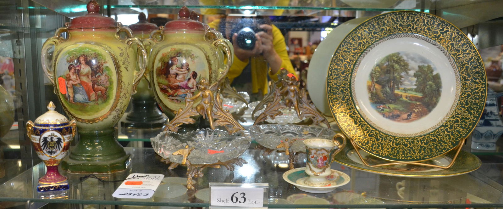 Shelf #63 - Porcelain & Glass: Shelf #63 - Porcelain & glass, including (2) glass bowls with brass cherub frames (mismatched bowls), pr Homer Laughlin plates John Constable The Cornfield Amsterdam Holland, (2) porcelain urns with c