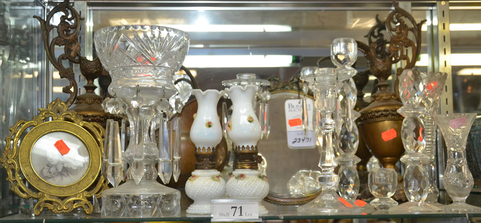 Shelf #71 - Brass & Glass: Shelf #71 - Brass & glass, including pr ewer garniture, beveled wall mirror (chip in glass), copper & brass coal scuttle, brass picture frame, cut glass footed bud vases, candlesticks (some with prism