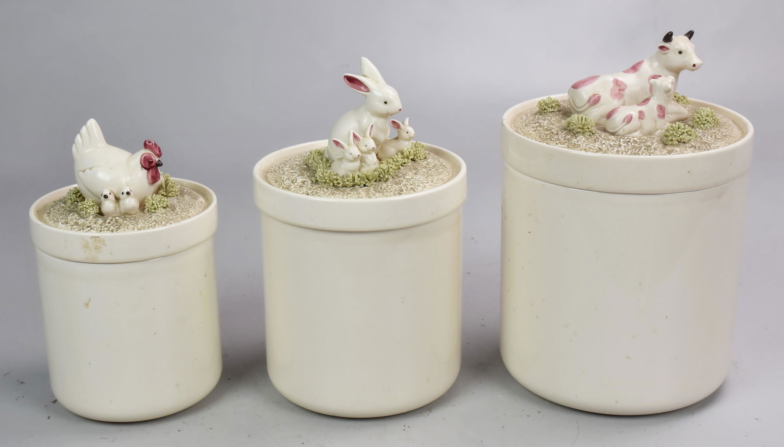 (3) Fitz and Floyd Graduated Canisters: (3) Fitz and Floyd Graduated Canisters Including Chickens, Rabbits and Cows (Tallest 10-1/2" h), (2 Have Hairlines on the Lid)
