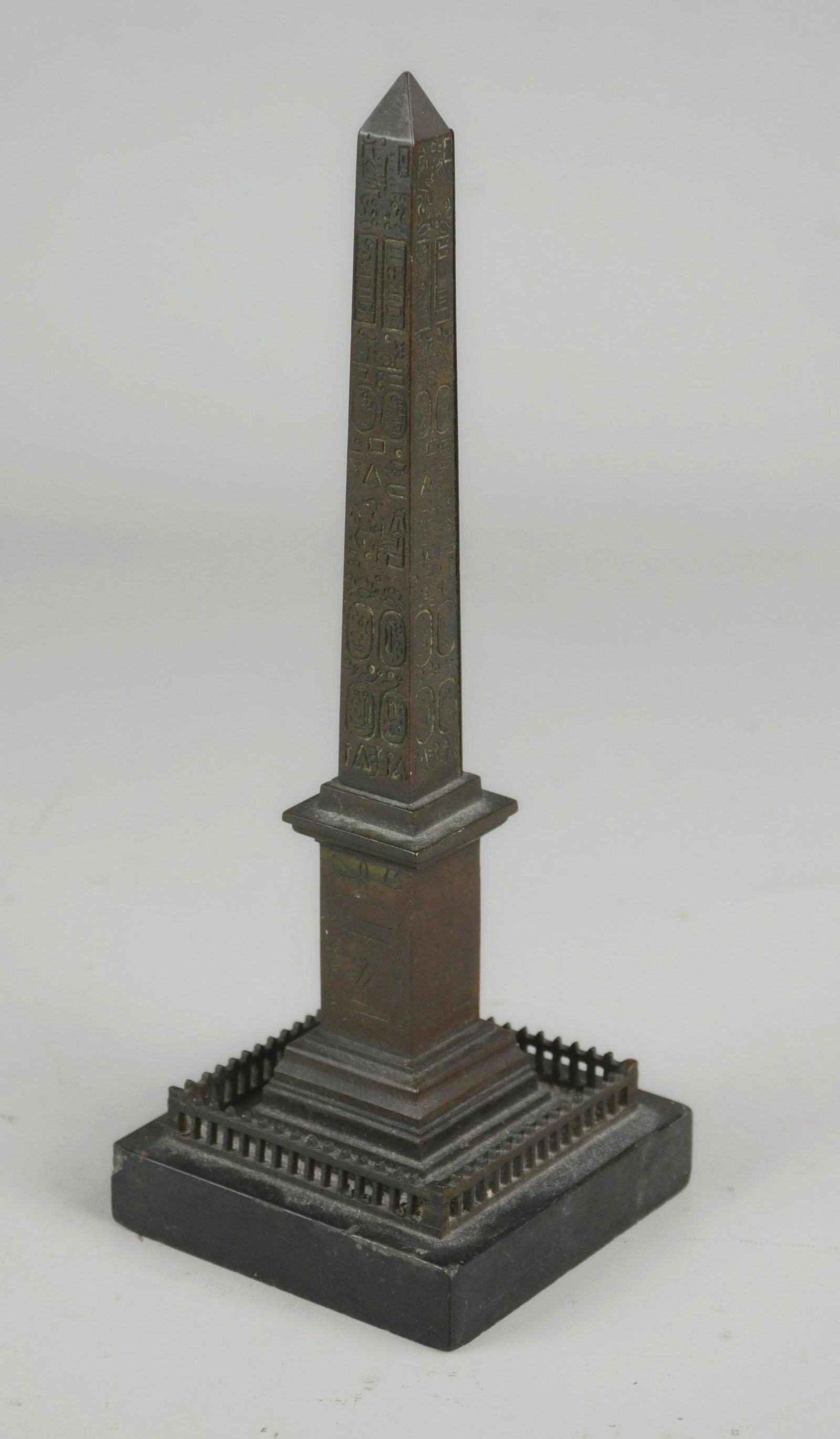 Bronze Luxor Obelisk: Grand Tour bronze obelisk of the Luxor in Paris with fence on slate base (some chips to slate), c 1900, 10-1/4" h overall