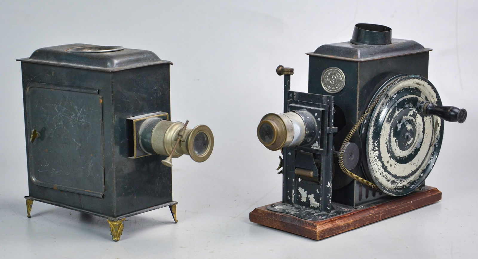 (2) Magic Lantern Projectors: (2) Magic Lantern projectors, largest marked "EP", largest 8-1/2" h x 10" d x 4" w