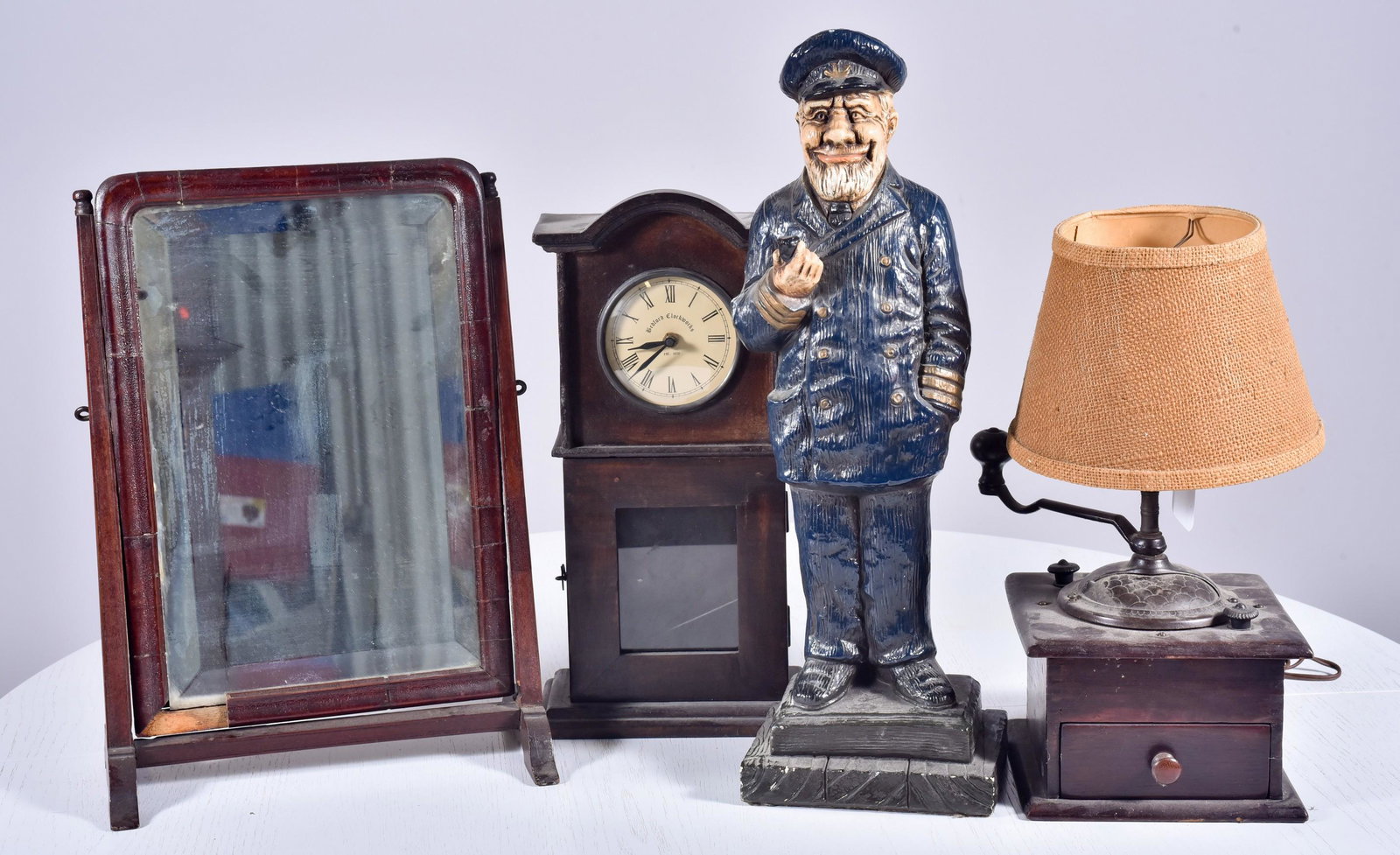 Statue, Mirror, Coffee Grinder and Clock: Ceramix Statue of Man with Pipe (21" h), Tilting Mahogany Mirror with Beveled Glass, Coffee Grinder Converted to a Lamp, Bedford Clockworks Clock