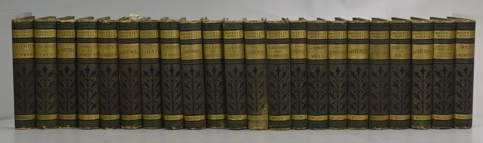 Sir Walter Scott " waverley Novels" - 22 Volumes: (22) Sir Walter Scott " waverley Novels" (DeWolfe, Fiske & Co., Boston) undated, but inscribed as a gift Christmas 1883 - 1885, original decorative cloth boards, 22 total volumes including the followi