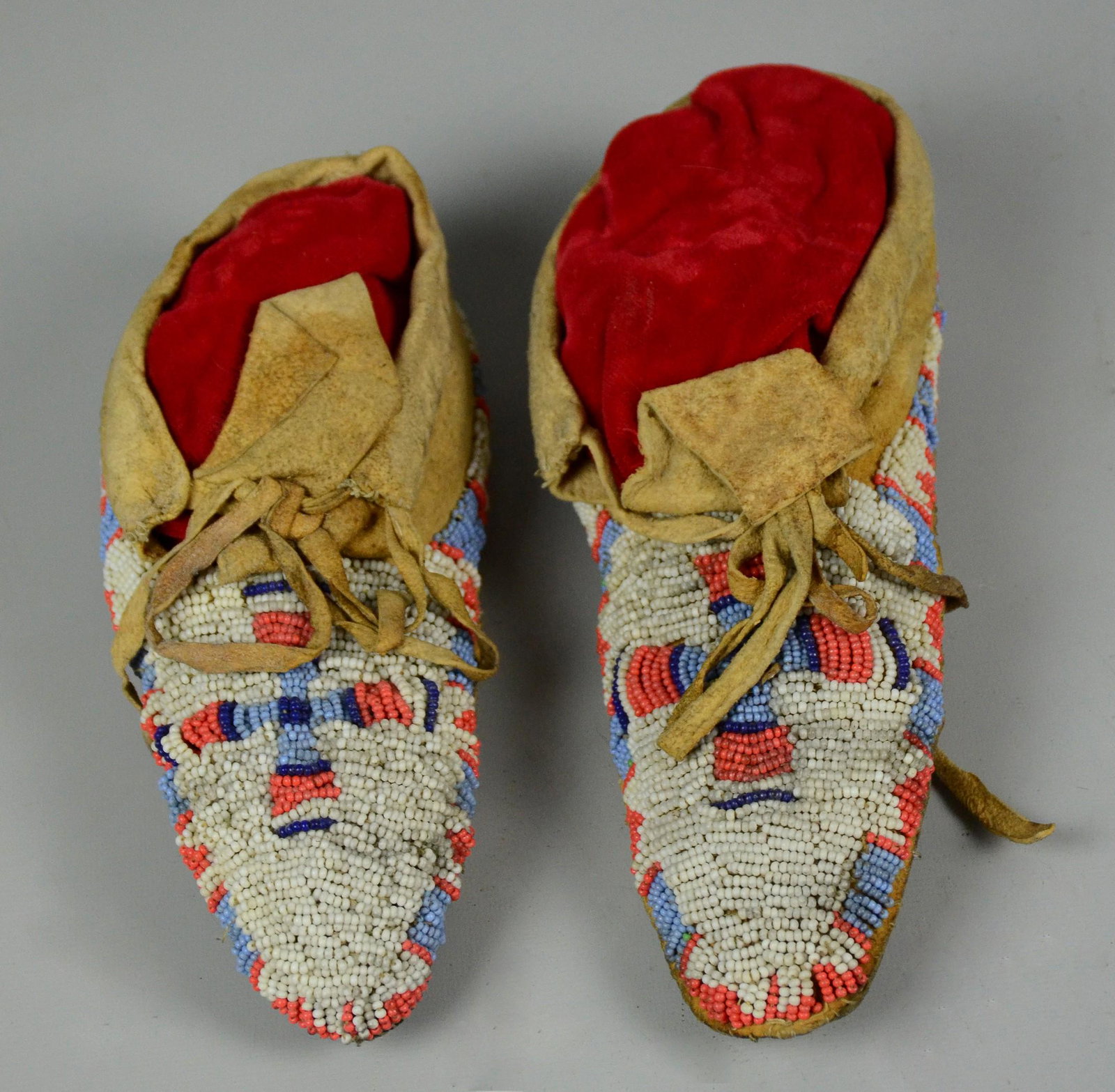 Native American Plains Beaded Children's Moccasins: Native American Plains Beaded Children's Moccasins, Sioux?, predominantly white, detailed with geometric designs & crosses, 8-1/4" L