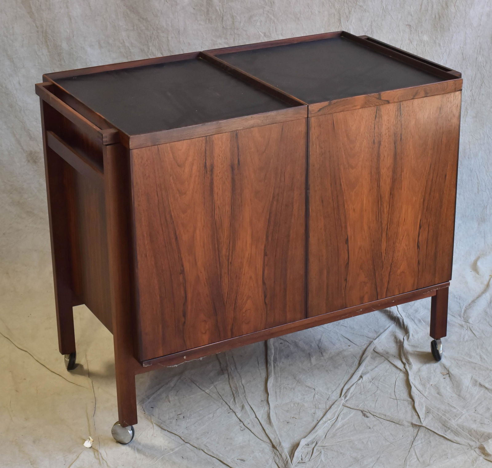 Niels Erik Glasdam Jensen rosewood bar cart: Niels Erik Glasdam Jensen rosewood Danish Design bar cart, pull apart at center with interior storage, laminate top, 29" h x 34" w x 18" d; one corner at base w/some wear