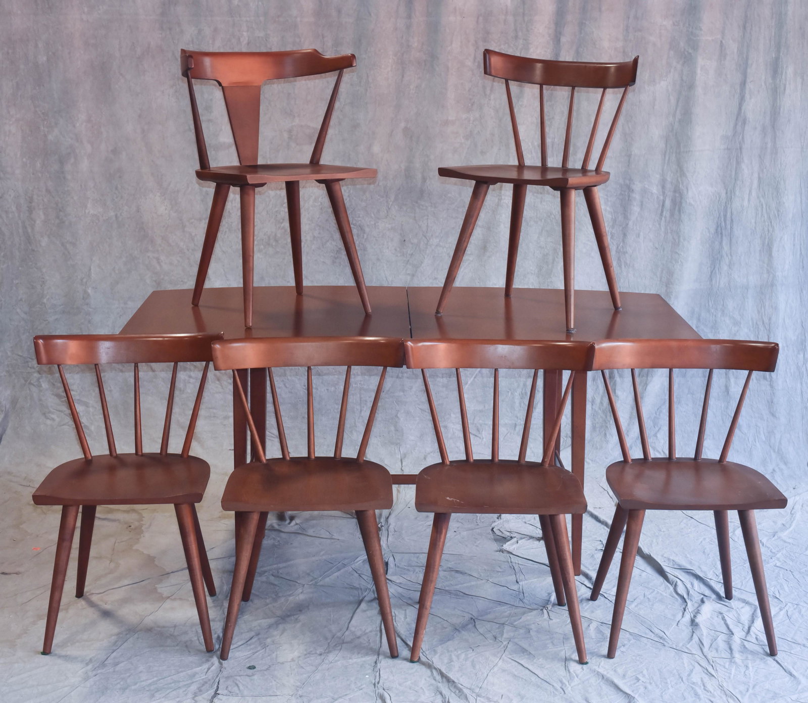 (7) pc Paul McCobb Modern Design dining set: (7) pc Paul McCobb Modern Design dining set, c/o 4 spindle back chairs, 2 side chairs, dining table w/ two 15" w boards (not shown in photo), 29" h x 67" w x 38" d; total length of table w/boards is 9