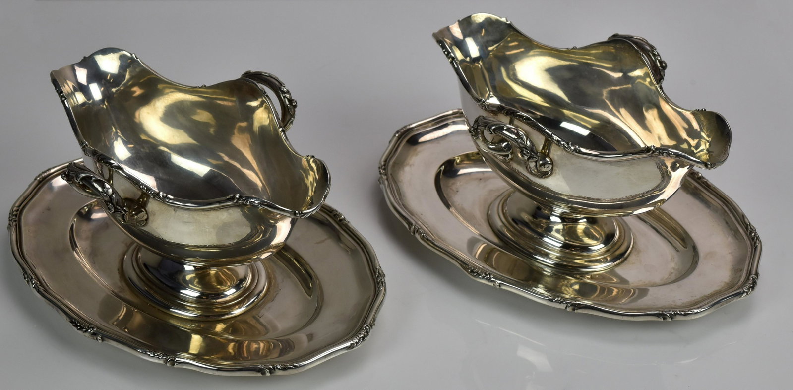 (2) JC Klinkosch 900 Silver Gravy Boats: (2) JC Klinkosch 900 silver gravy boats with attached under trays, Vienna, 10" w x 4-3/4" h, 54.63 TO, see lots 20271 & 20272 for matching pieces