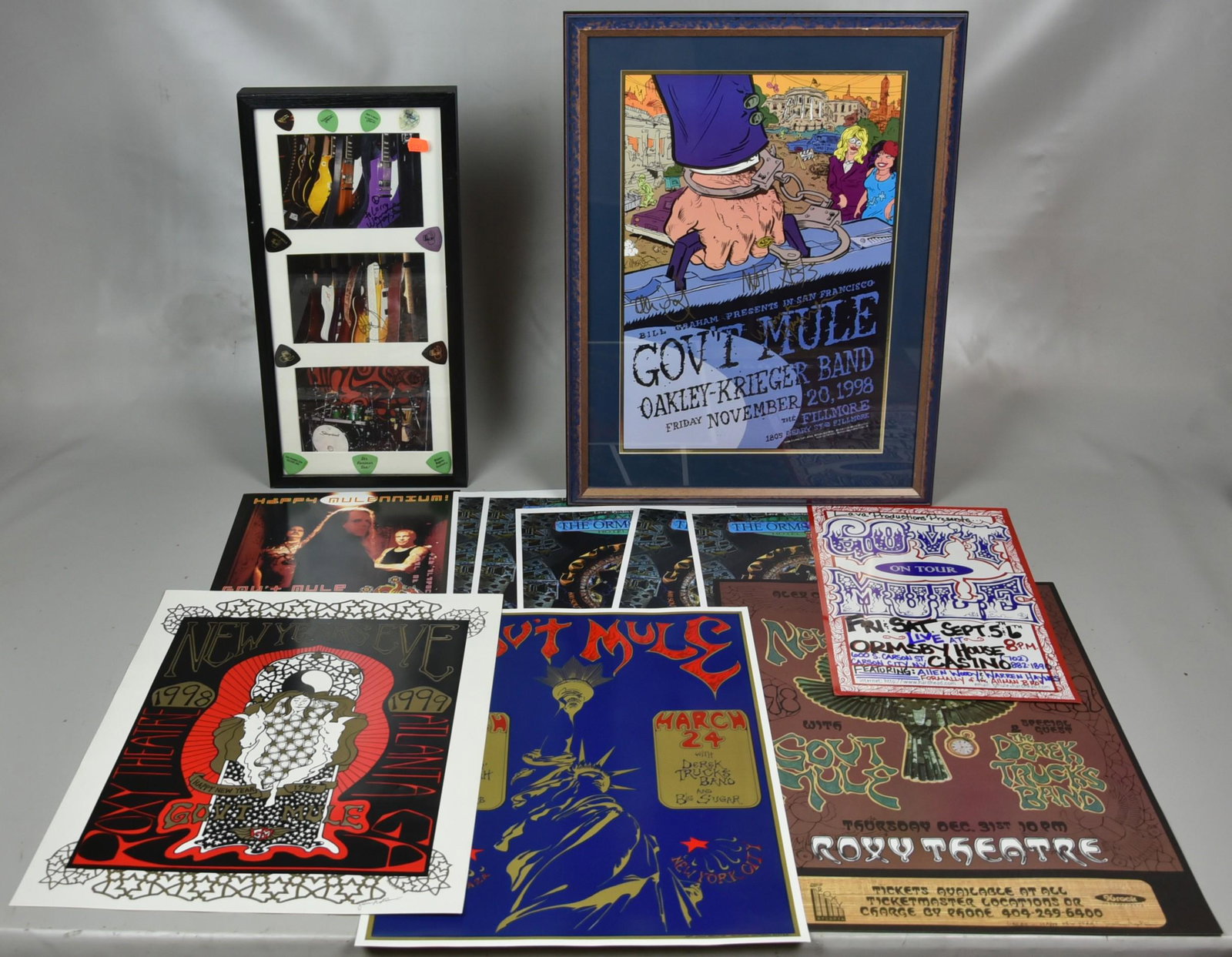 Government Mule Items and Concert Posters: Signed Government Mule (Wayne Haynes, Matt Abts, Jorgen Carlsson) Bill Graham BG350 Poster, (Framed 24" l x 18"), (3) Colored Photos of Band Instruments Signed by the Respective Band Members Inscribed
