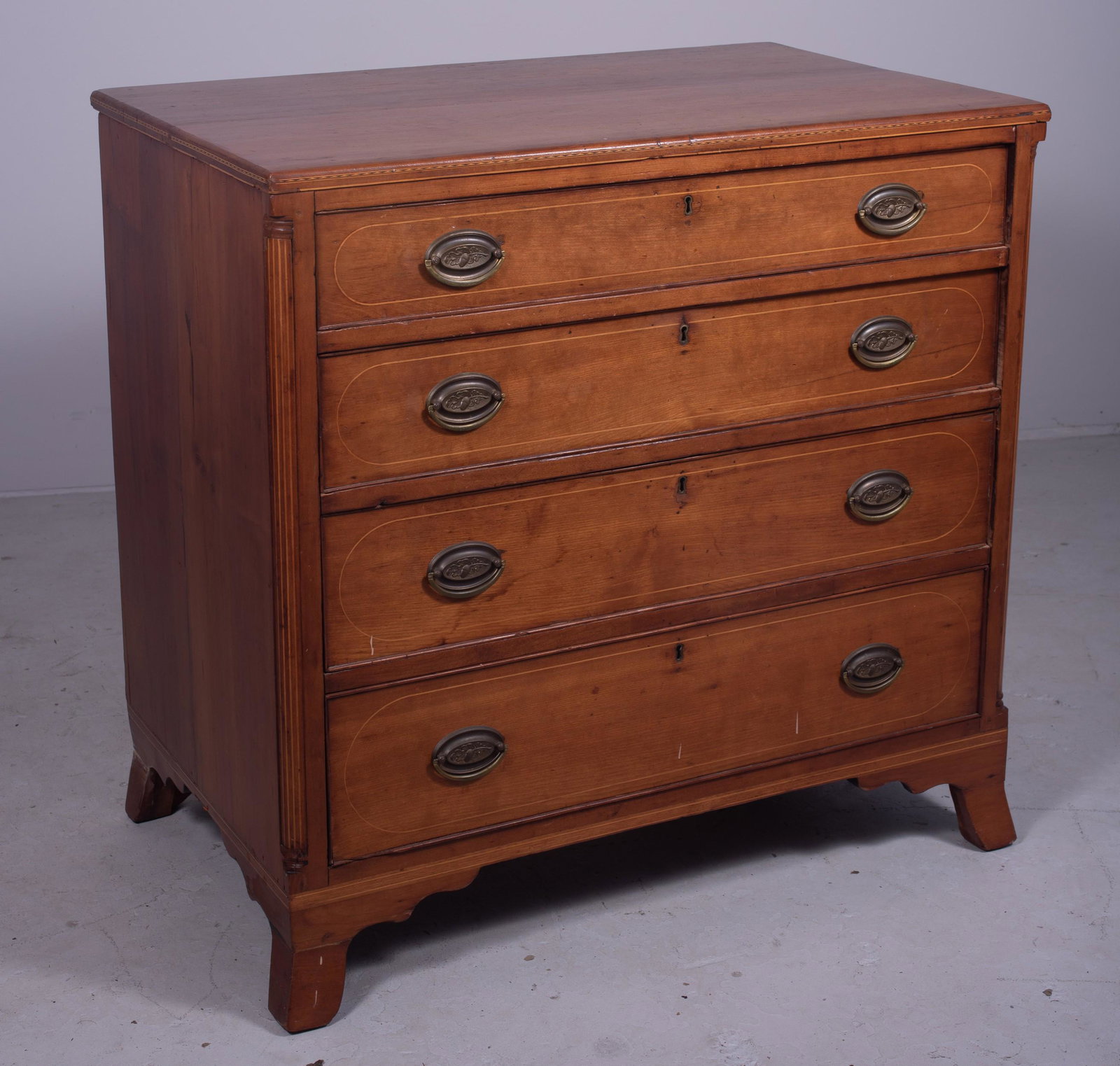 Inlaid Cherry Transitional 4 drawer Hepplewhite bureau: Inlaid Cherry Transitional 4 drawer Hepplewhite bureau, top with string and geometric inlay, 4 graduated beaded edge drawers with string inlay, replaced brasses, flanked by string inlaid inset quarter