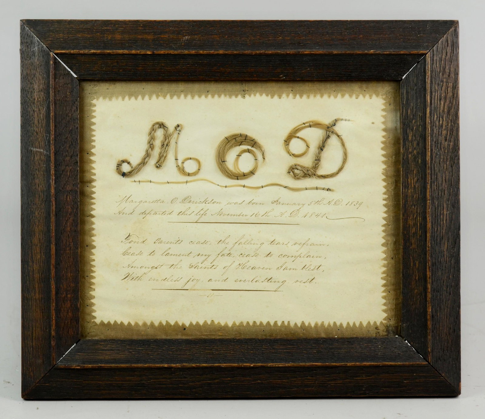 1841 Framed Woven Hair Memento Mori: 1841 Framed woven hair memoriam for Margaretta O. Derickson with 6-line inscription, her initials in embroidered hair with sawtooth cloth border, overall 11-3/4" x 13-1/4", sight 73/4-" x 9-3/4"