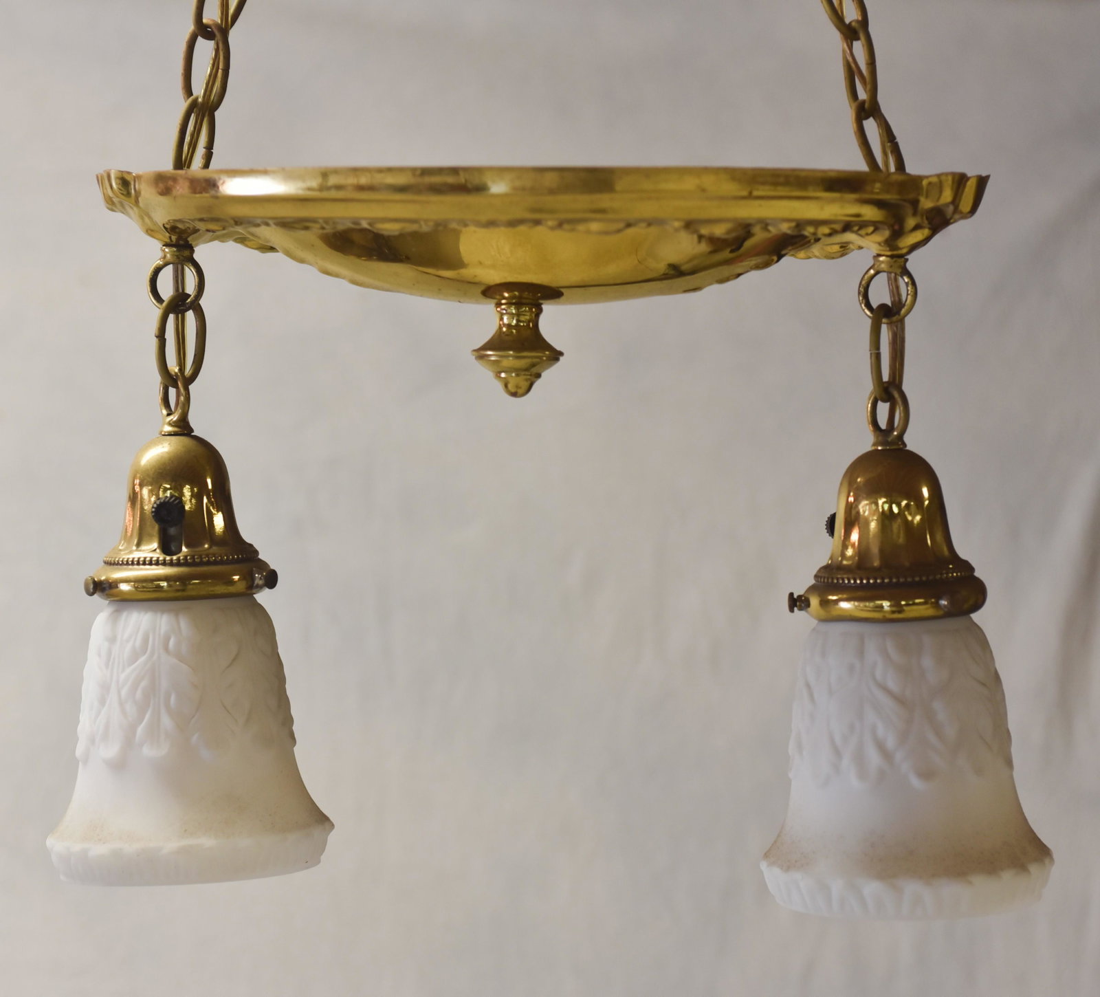 Brass 2-light hanging light fixture: Brass 2-light hanging light fixture, white frosted glass shades, 15" w