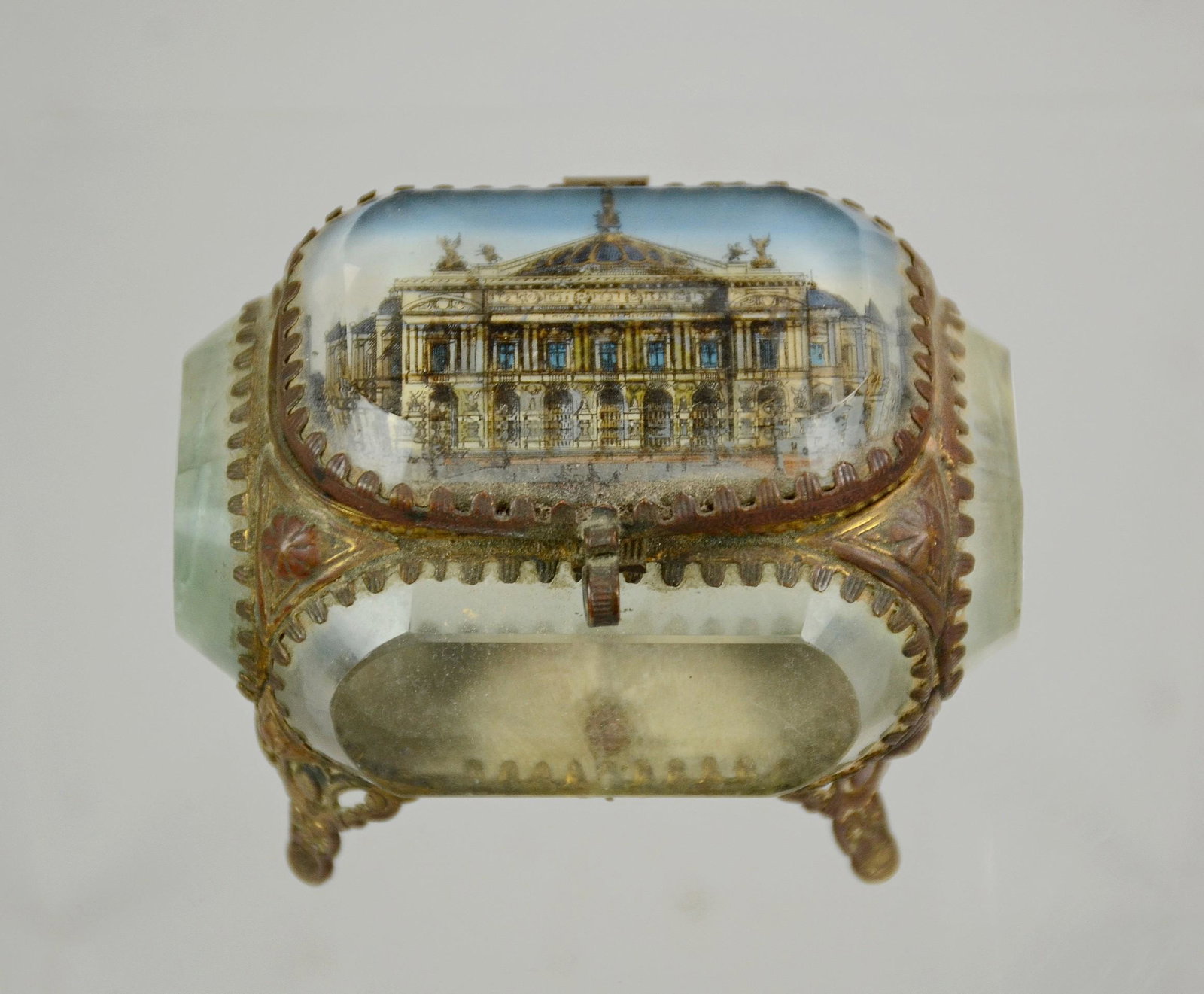 Brass & Glass Miniature Jewelry Casket: Brass & beveled glass miniature jewelry casket, reverse painted classical building on lid, mirror inside lid, tufted velvet interior, 3-1/4" w x 2-1/4" d x 2-1/2" h