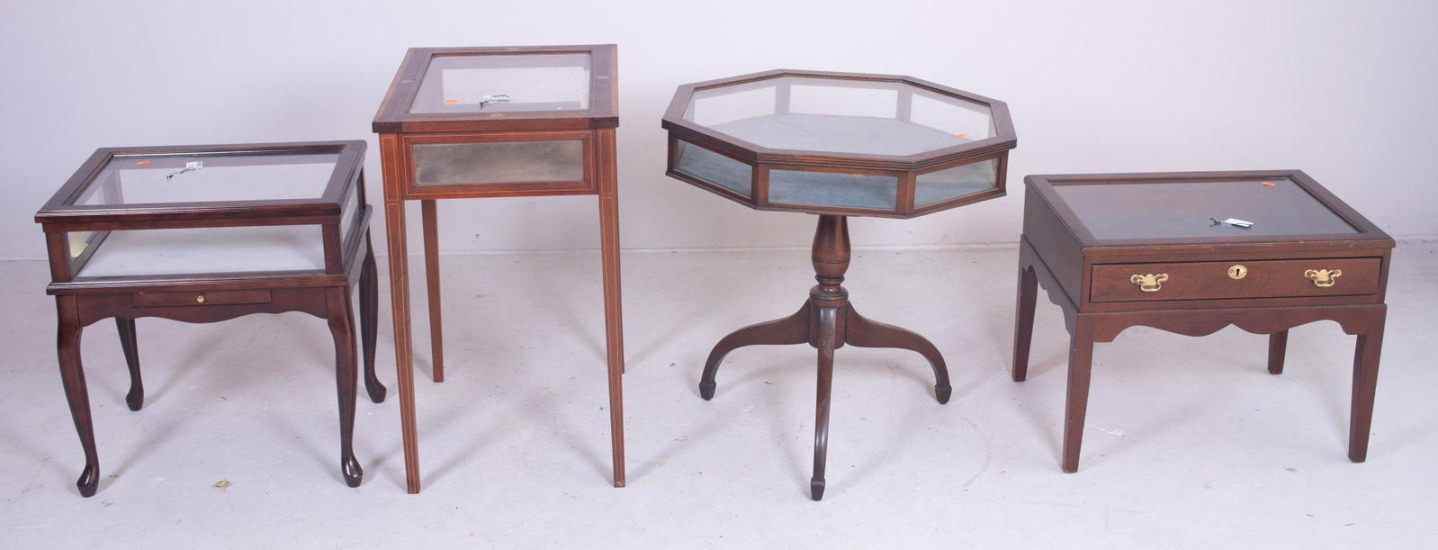 (4) Vitrine tables: (4) Vitrine tables, c/o Hepplewhite style inlaid table with beveled glass, wear to veneer, 30" h x 24" w x 14" d, second Mahogany Queen Anne style table, loose frame, 24" h x 17-1/2" w x 14" d, third 