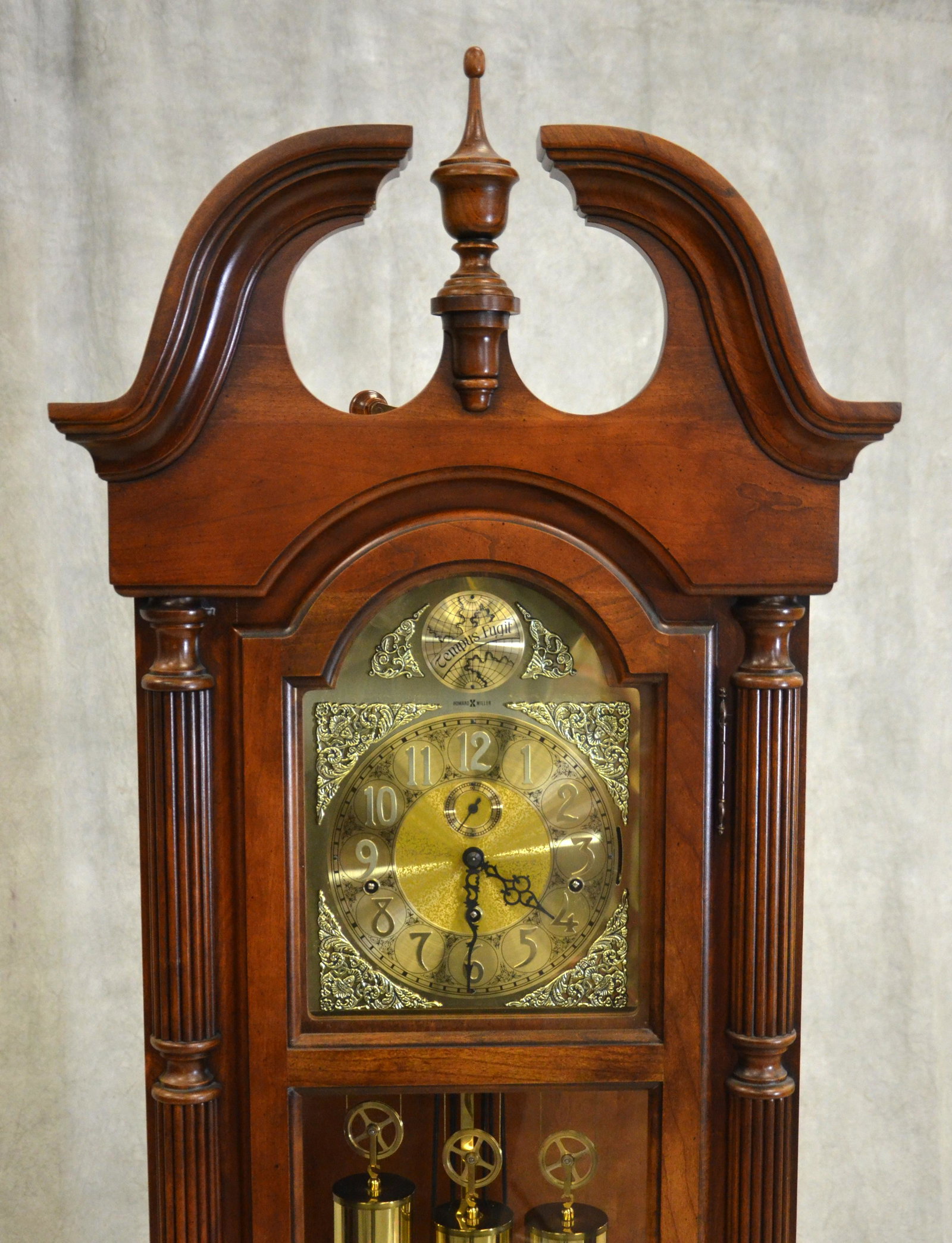 Howard Miller cherry hall clock: Howard Miller cherry hall clock, 3 weight, wire Westminster chime, running when wound, no warranty intended