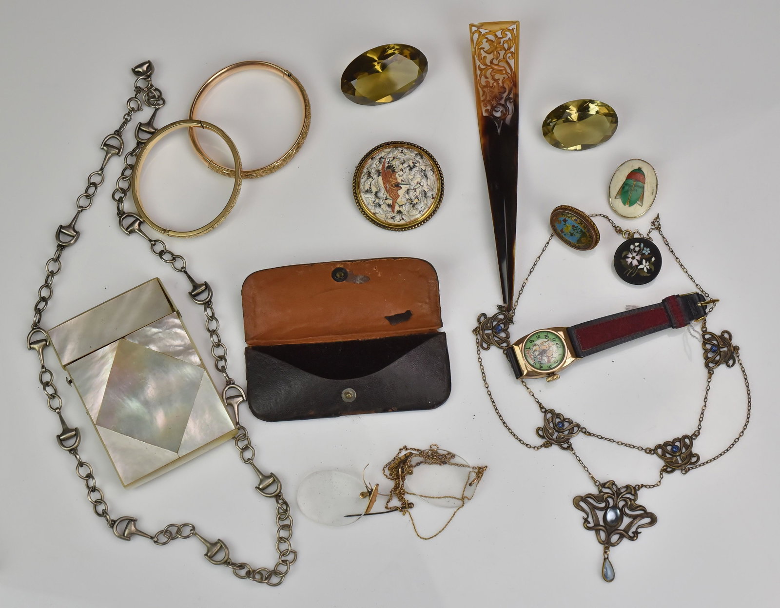 Miscellaneous lot of Jewelry, some 14KT: 14K Gold Glasses with 14K Gold Chain, Mother of Pearl Cigarette Case, Inlay Pin, Gold Filled Cufflink with Enamel Floral Decoration, (2) Smokey Topaz Oval Loose Stones, 14K Gold Pin with Firefly Made 