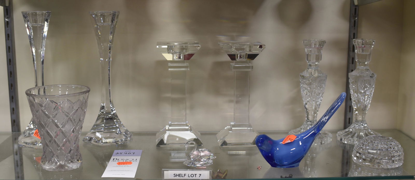 Shelf #7 - Crystal Pieces Including Candlesticks: Shelf #7 - (3) Pairs of Crystal Candlesticks Including: One Signed Illegibly (Tallest 10" h), Swarovski Crystal Swan (Chip on Tail), Crystal Paperweight, Blue Fenton Art Glass Bird