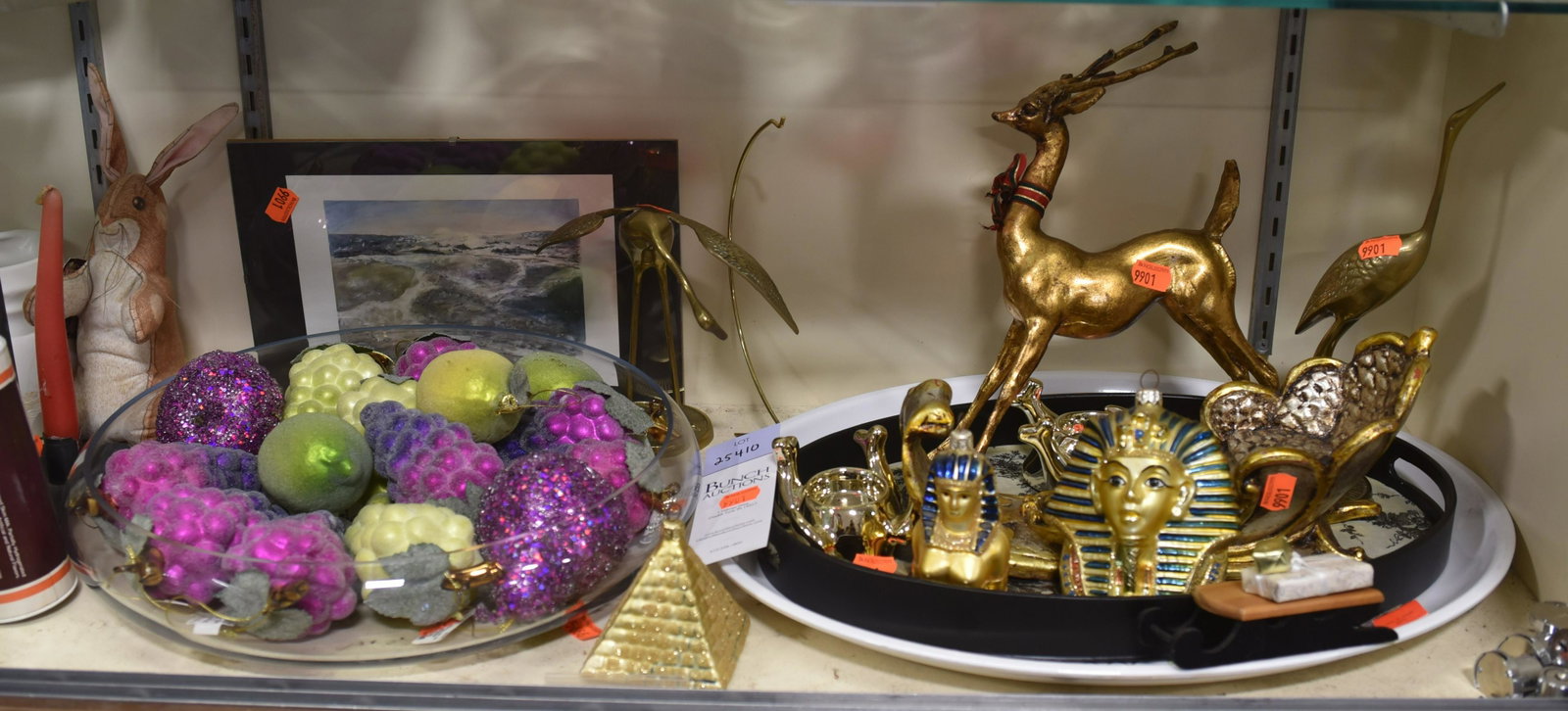 Shelf #10 - Ornaments and Brass Birds: Shelf #10 - Large Glass Bowl Containing Christmas Ornaments: Grapes, Pears and Lemons, Egyptian Ornaments Including: King Tut, Pyramid, Reindeer and Sled, Candle Holders, Brass Birds, (2) Trays, abstr