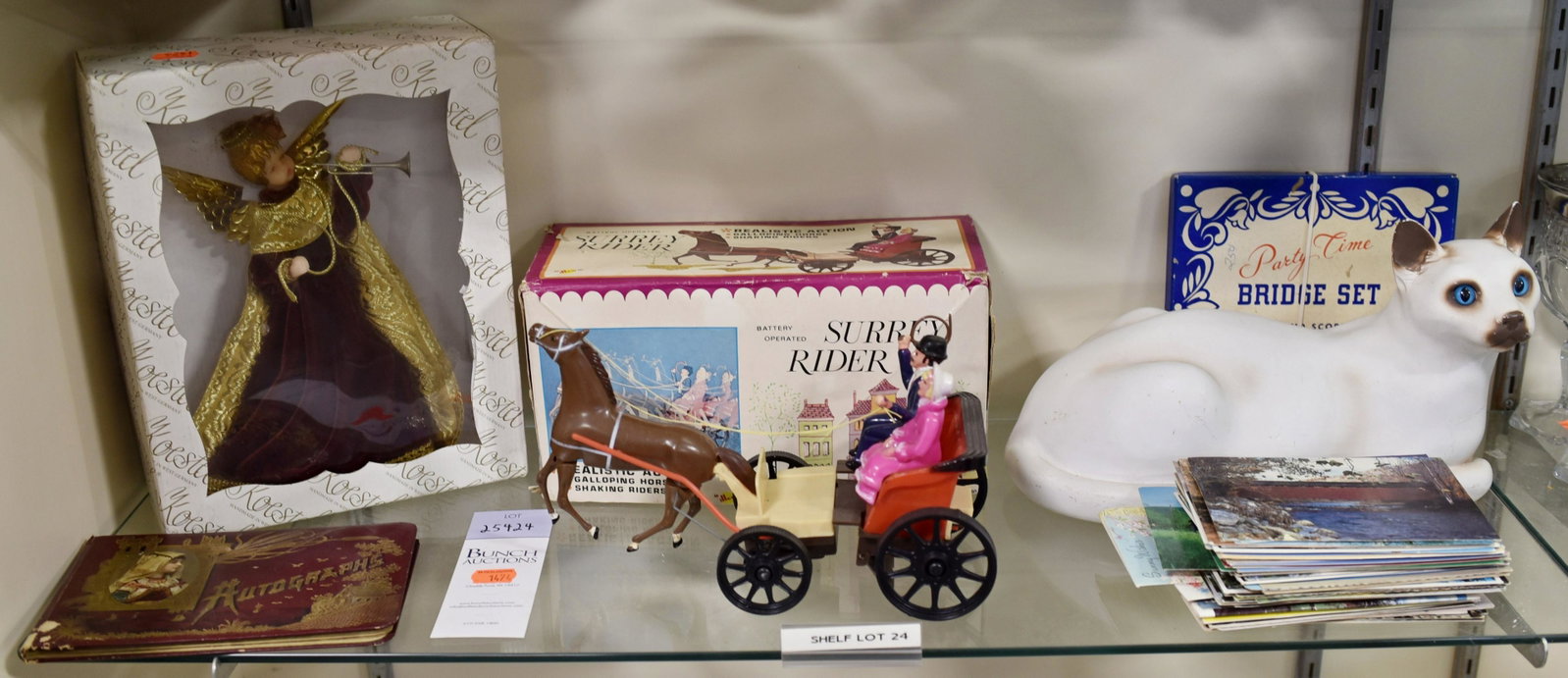 Shelf #24 - Surrey Rider Toy, Cat, Postcards: Shelf #24 - Battery Operated Surrey Rider Toy, Resin Cat with Blue Eyes, West German Koestel Wax Ornament, Lot of Postcards, Party Time Bridge Set